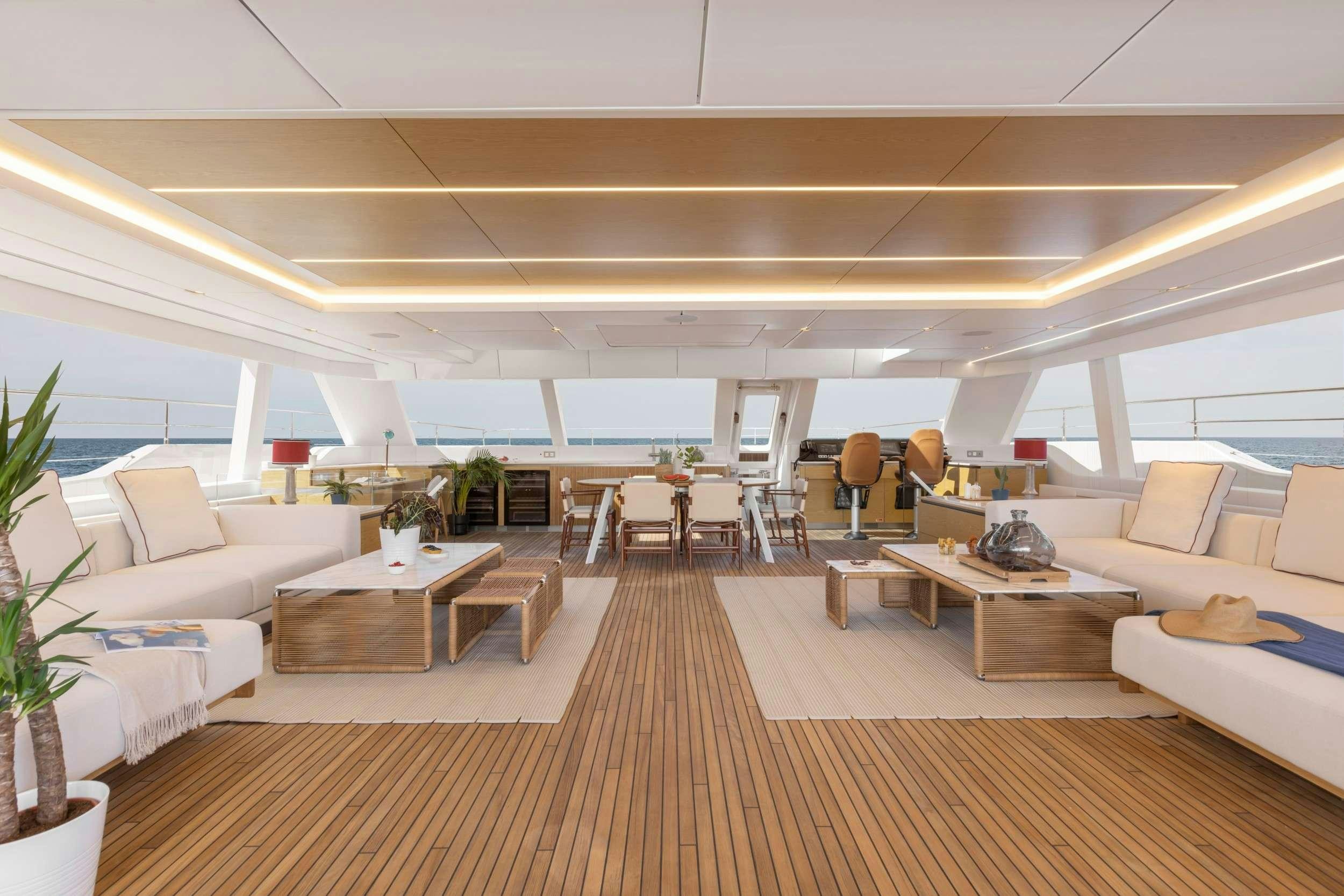a room with a couch and a table aboard PRONTO Yacht for Charter