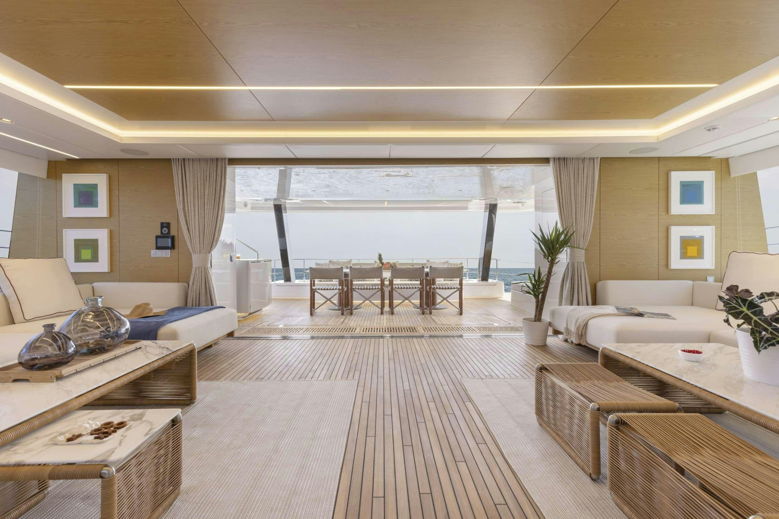 a large living room with a large balcony aboard PRONTO Yacht for Charter