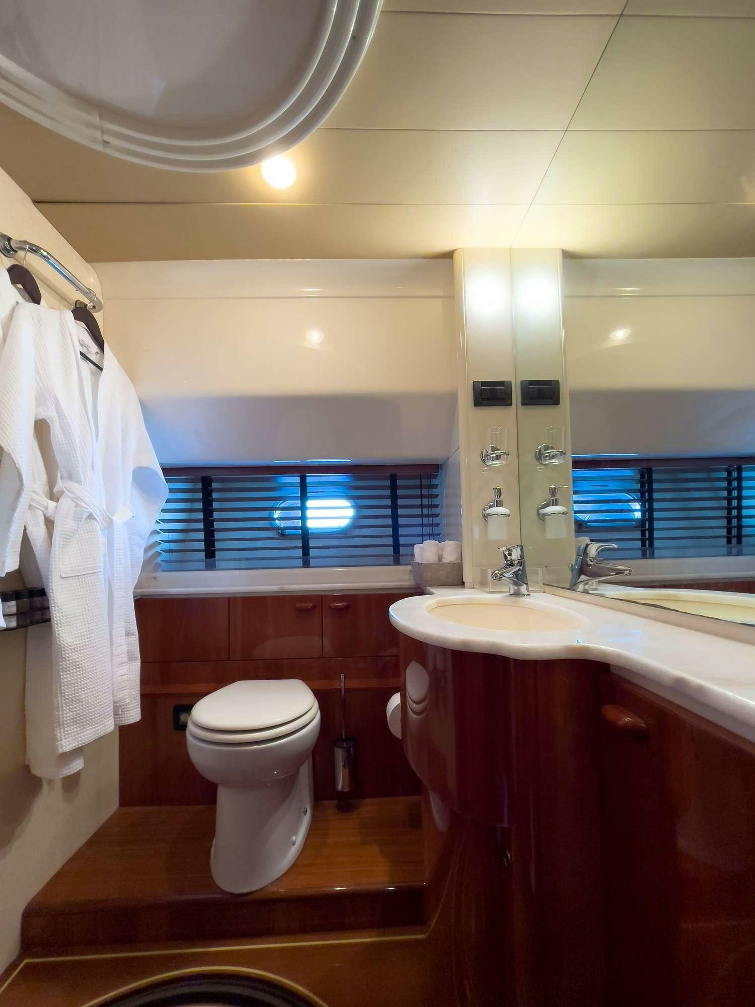 a bathroom with a sink toilet and a bathtub aboard MY WAY Yacht for Charter