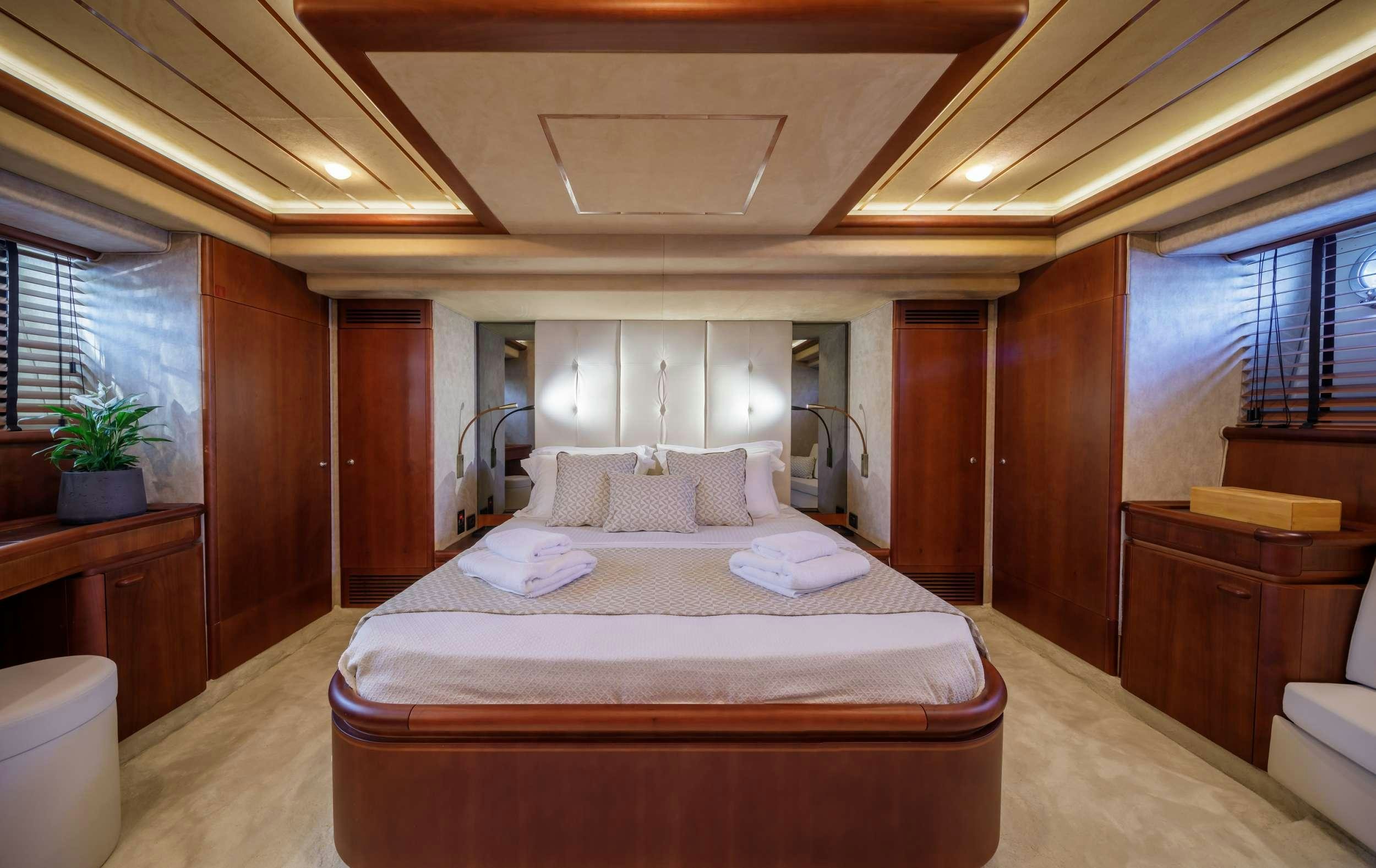 a large bedroom with a large bed aboard MY WAY Yacht for Charter