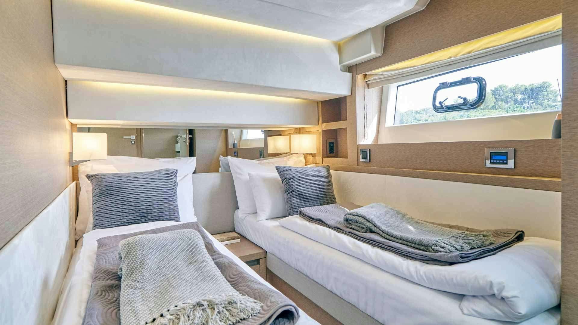 a room with two beds aboard SIMULL Yacht for Charter