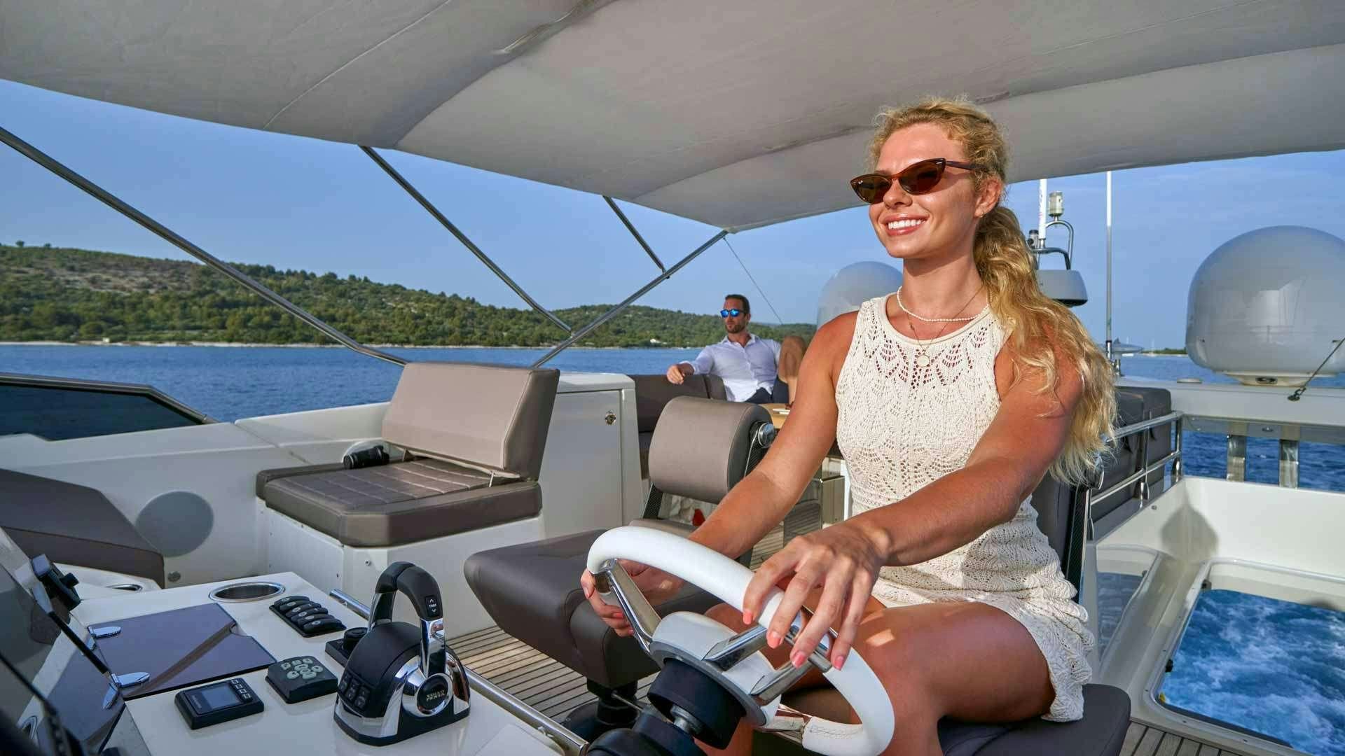 a person sitting in a boat aboard SIMULL Yacht for Charter