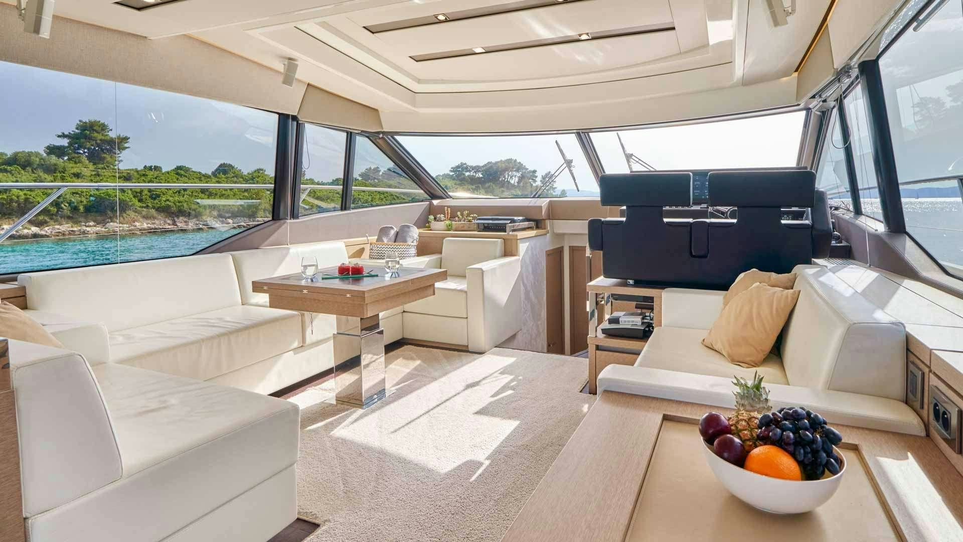 a living room with a large window aboard SIMULL Yacht for Charter