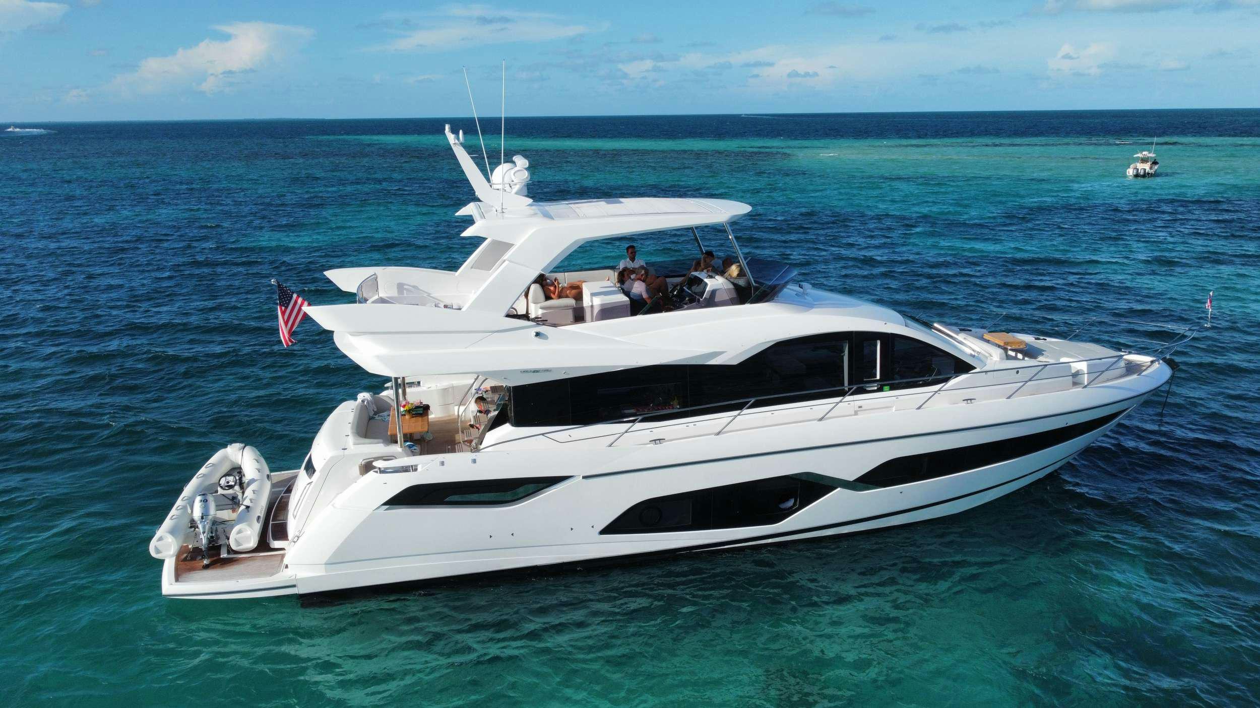a white boat in the water aboard LAGO PARADISE Yacht for Charter