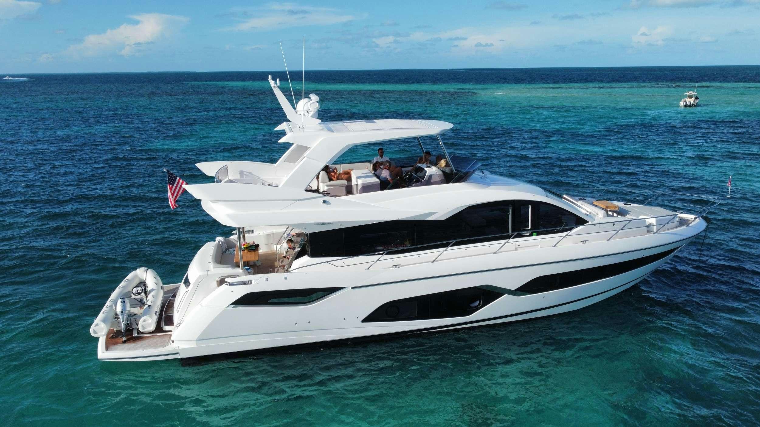 a white boat in the water aboard LAGO PARADISE Yacht for Charter