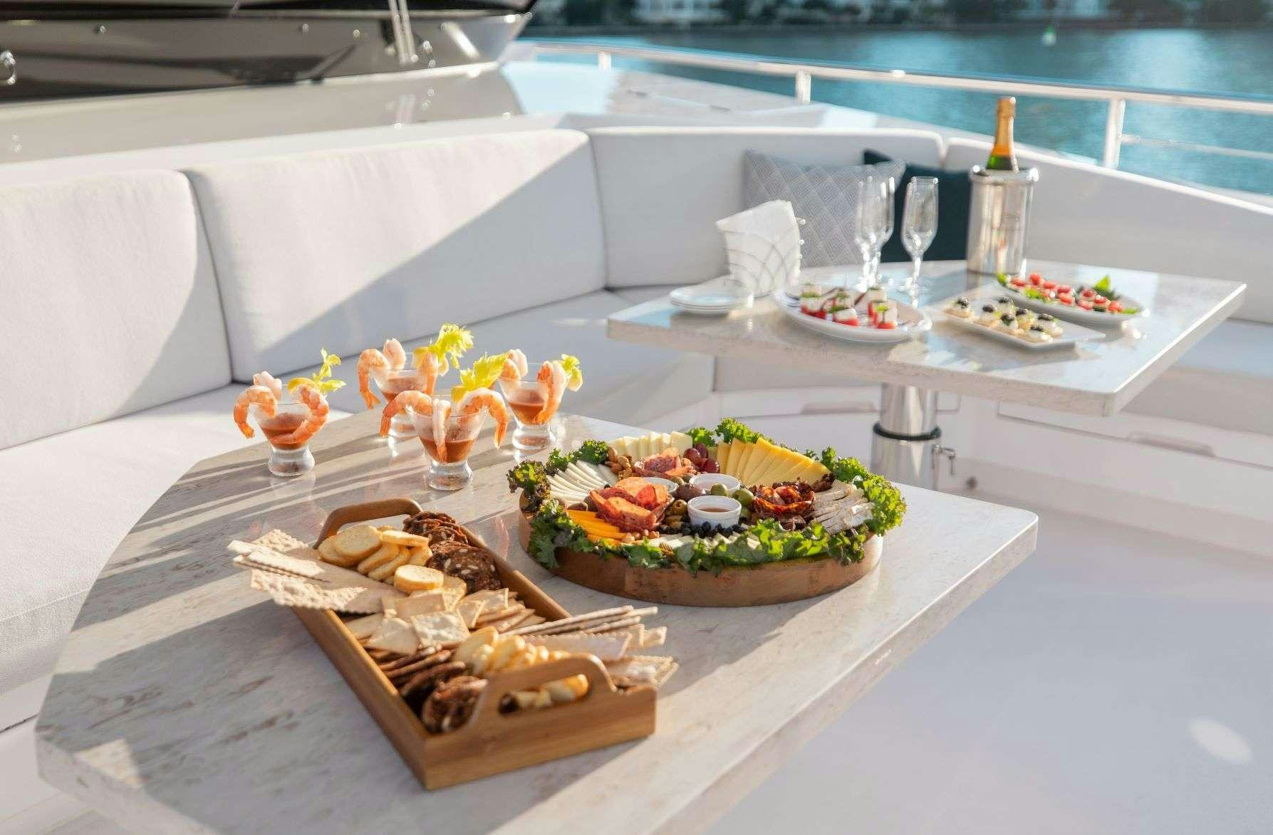 a table with food on it aboard FREEDOM Yacht for Charter