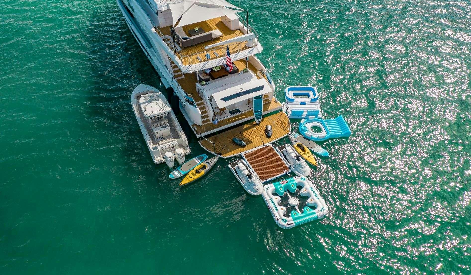 a group of boats on the water aboard FREEDOM Yacht for Charter
