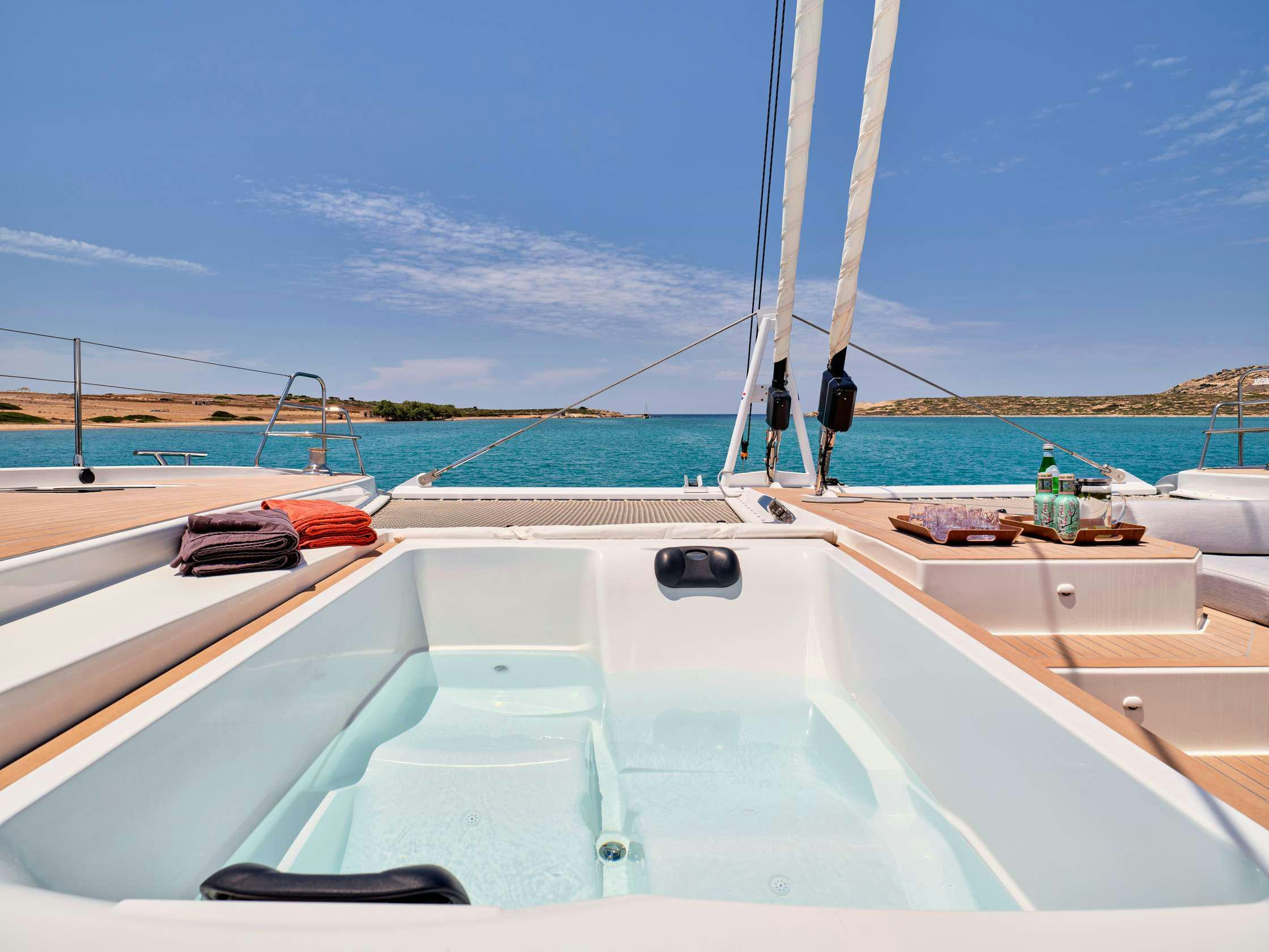 a boat with a person on it aboard PIXIE Yacht for Charter