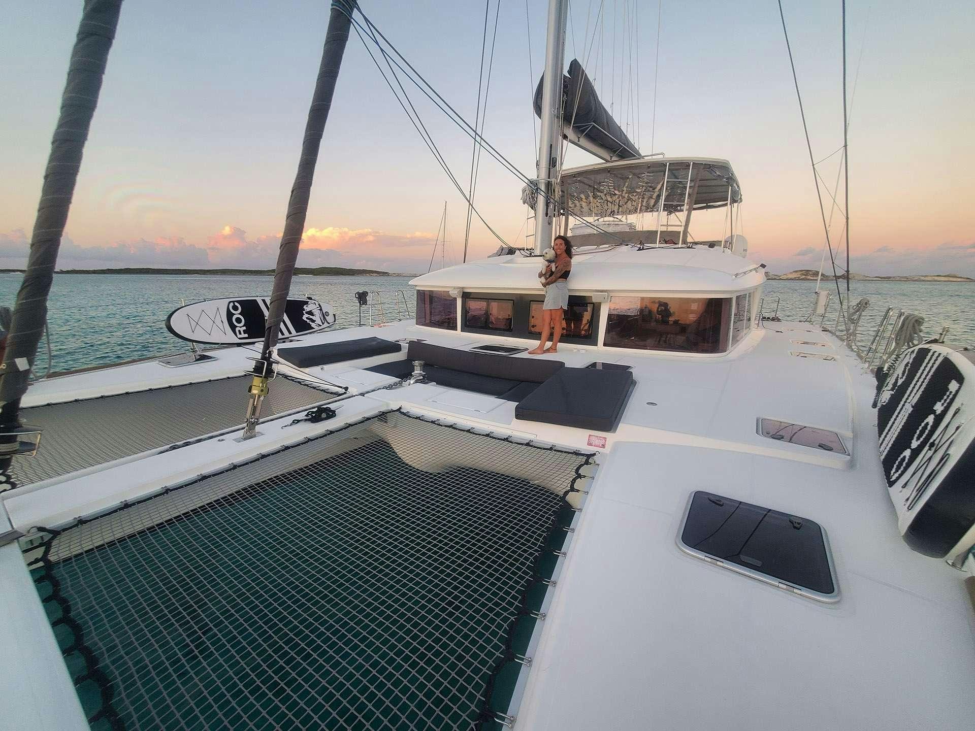 a person standing on a boat aboard BLUE CAT Yacht for Charter