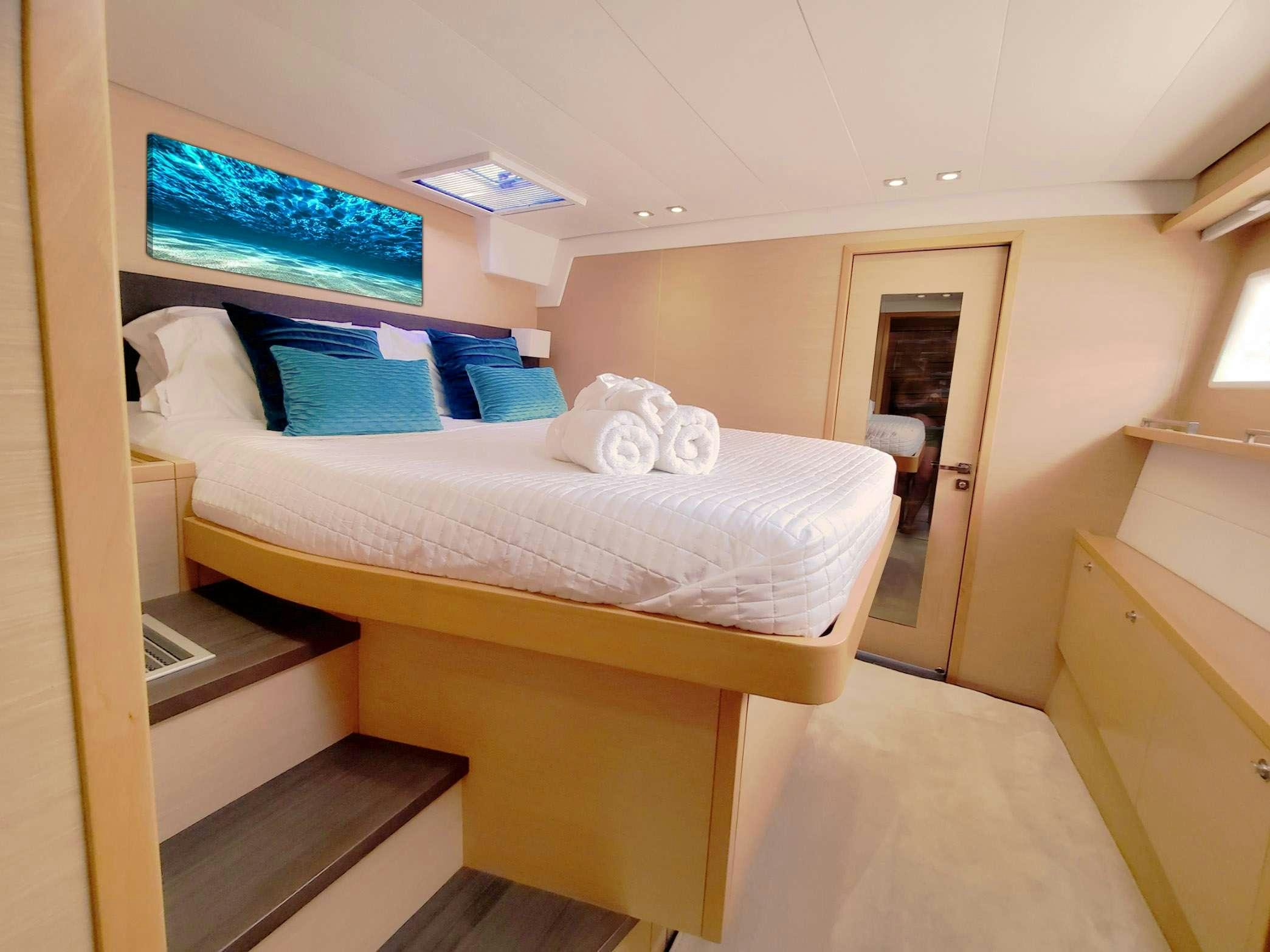 a room with two beds aboard BLUE CAT Yacht for Charter