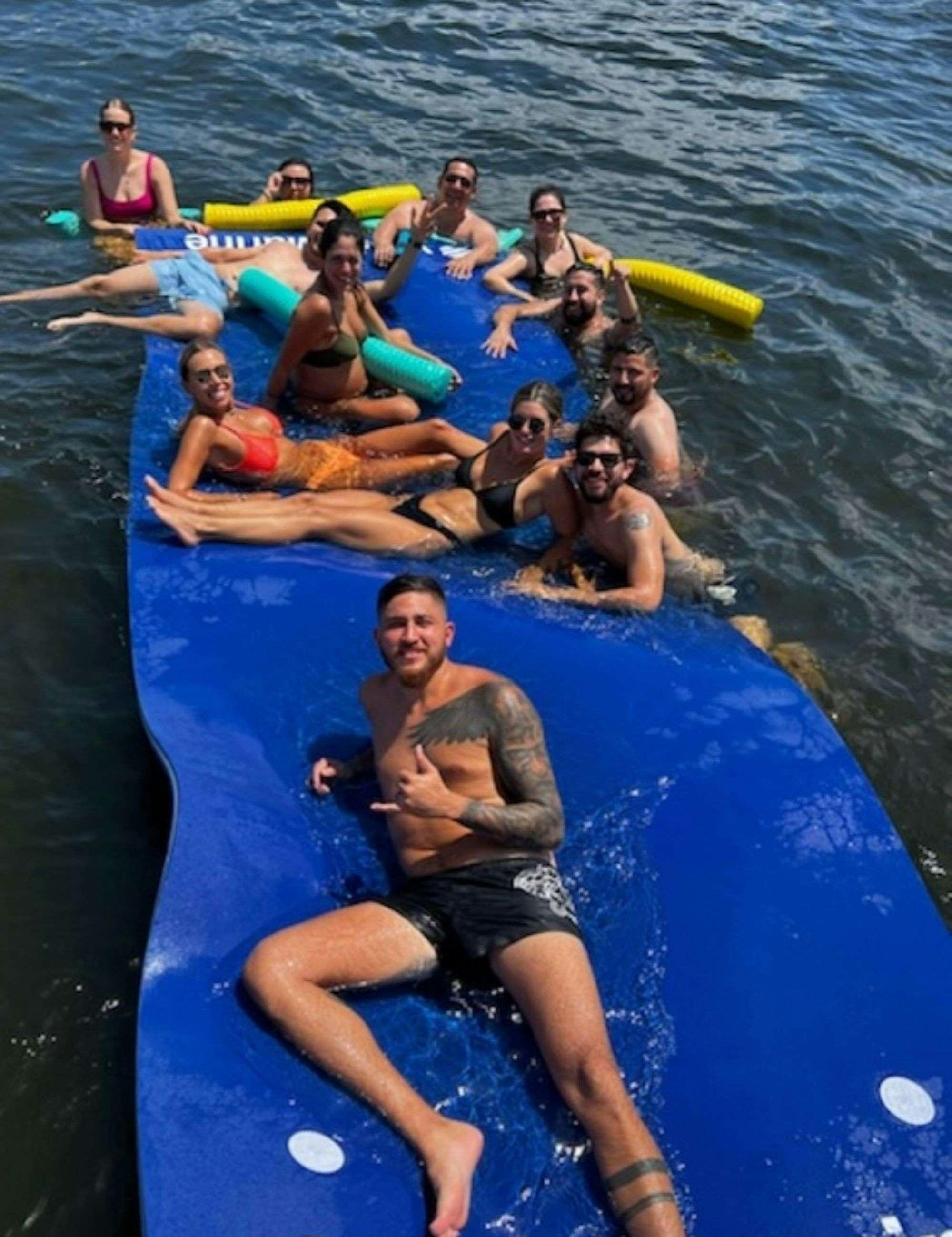 a group of people in a pool aboard EPIC Yacht for Charter