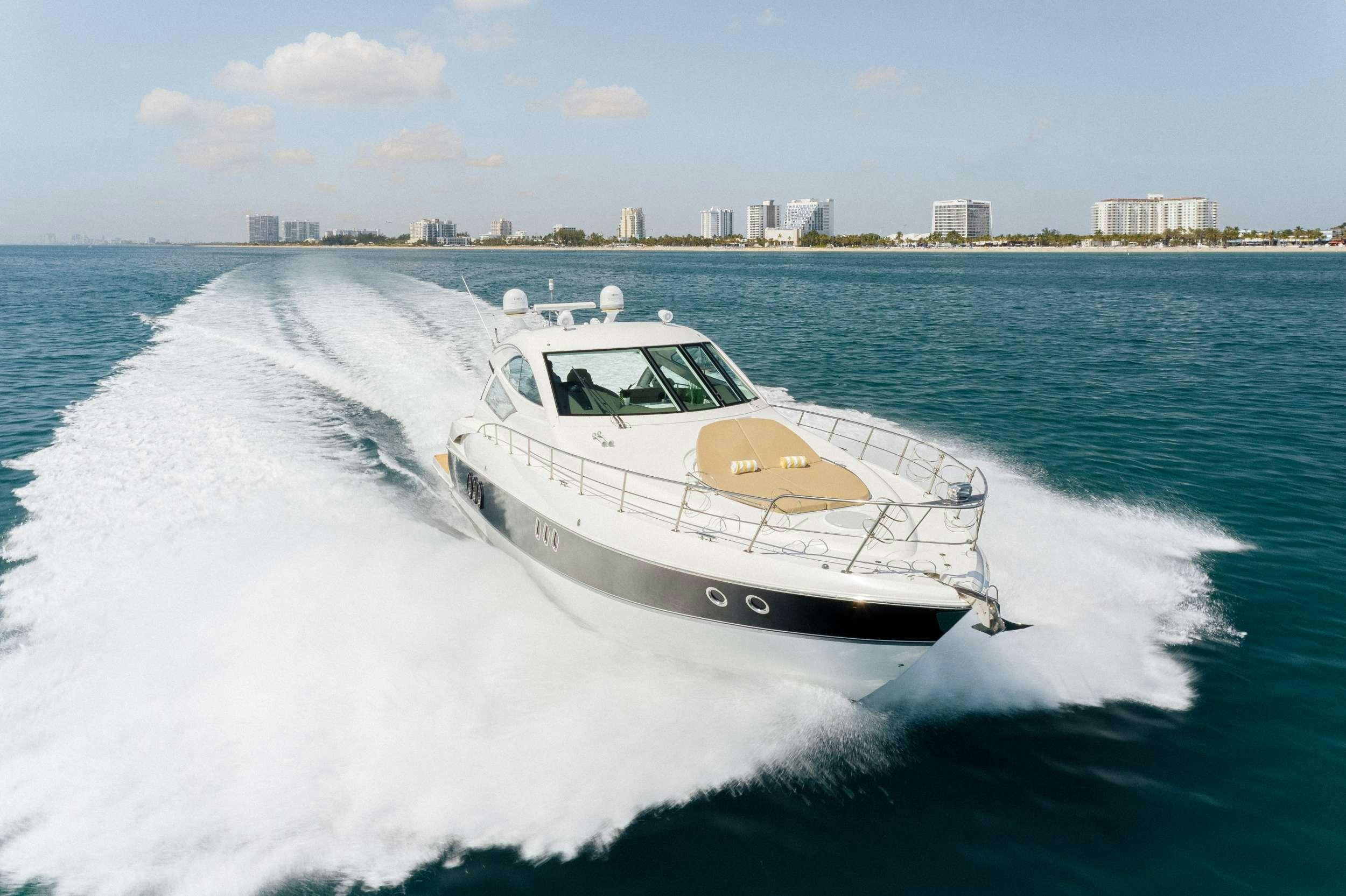 a white boat on water aboard EPIC Yacht for Charter