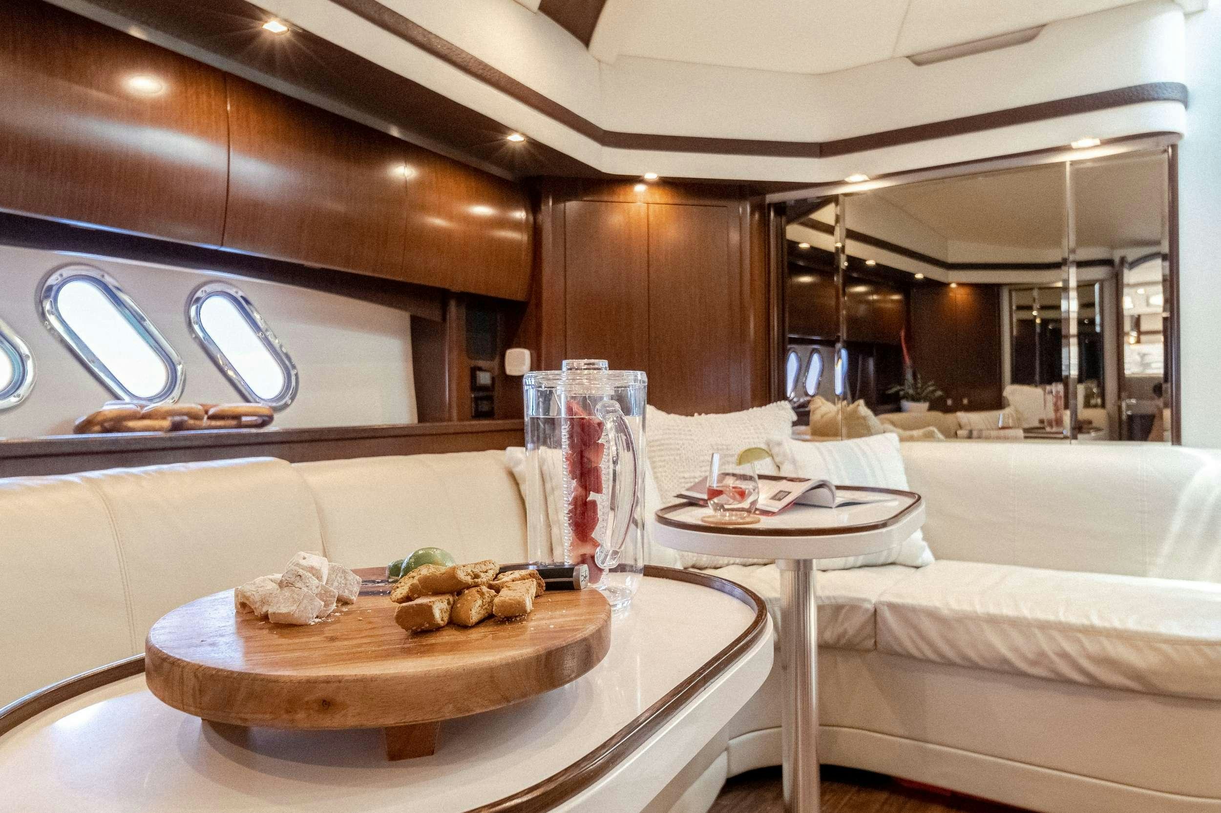 a room with a table and food aboard EPIC Yacht for Charter