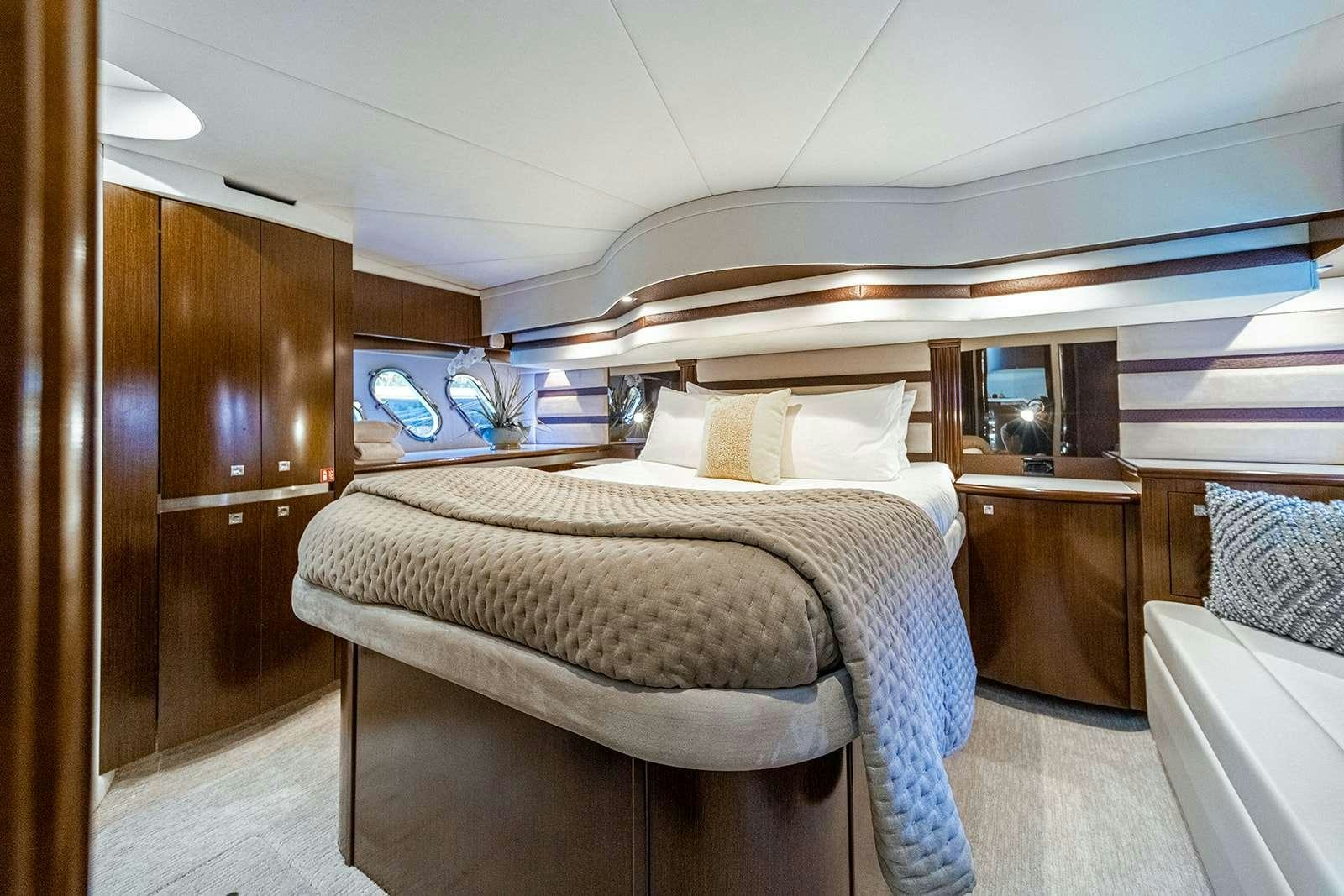 a bed in a room aboard EPIC Yacht for Charter