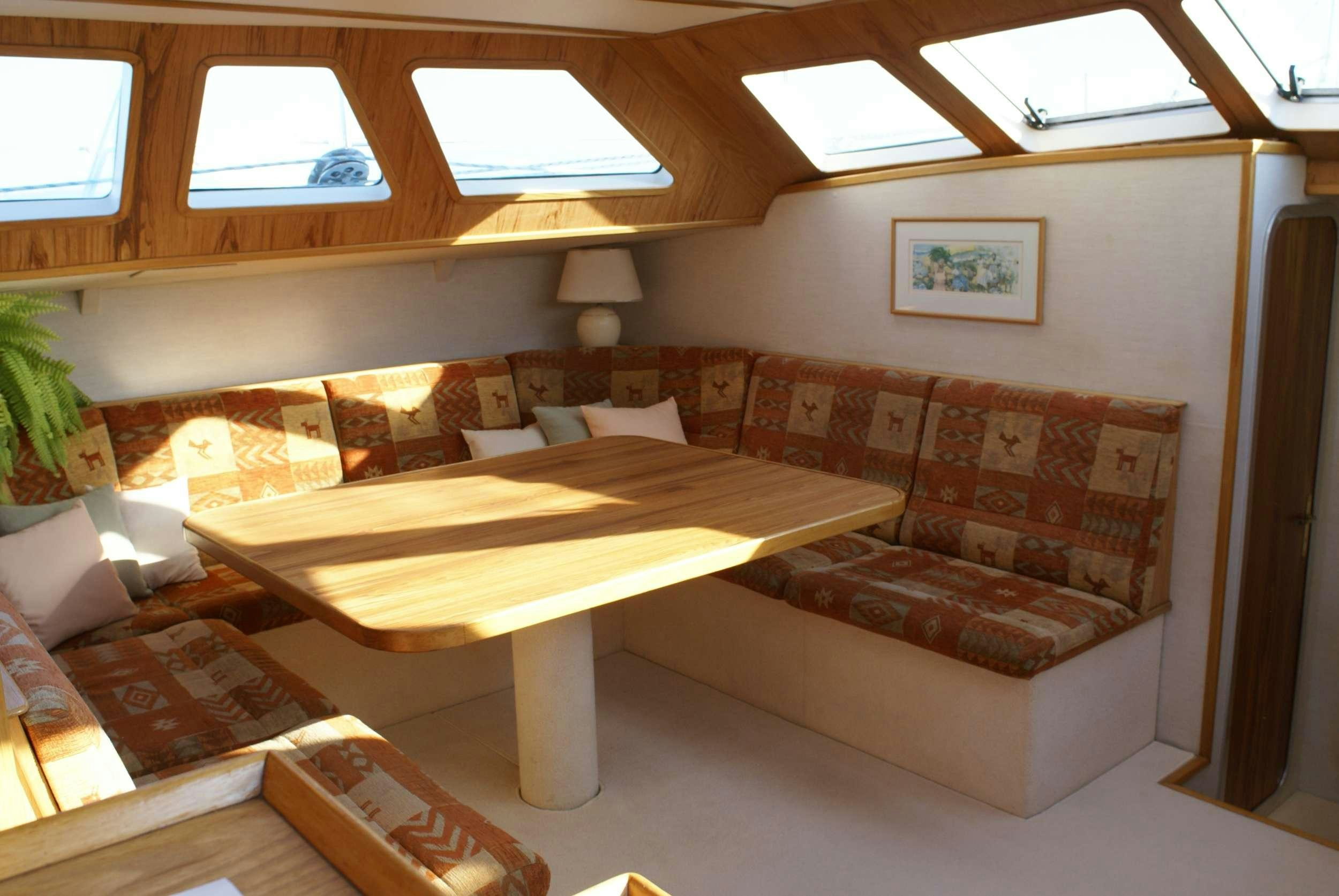 a room with a couch and a table aboard JAIPUR Yacht for Charter