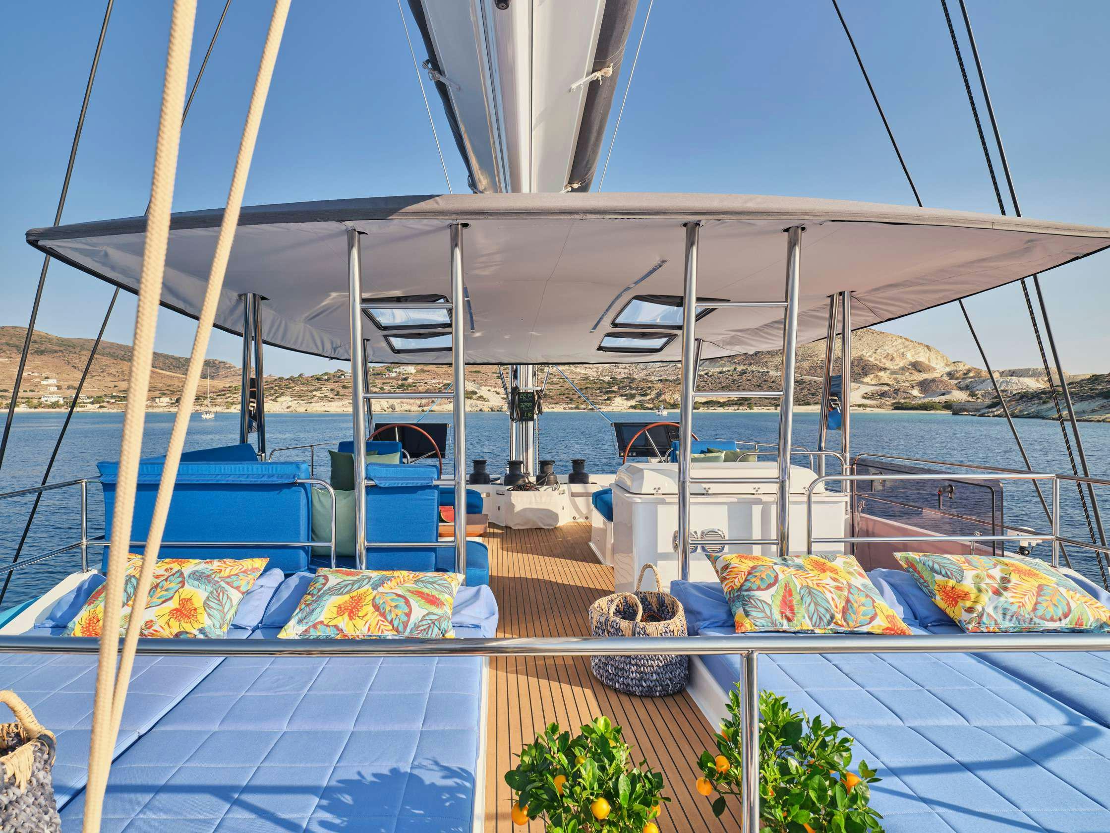 a covered patio with a table and chairs on it aboard APHAEA Yacht for Charter