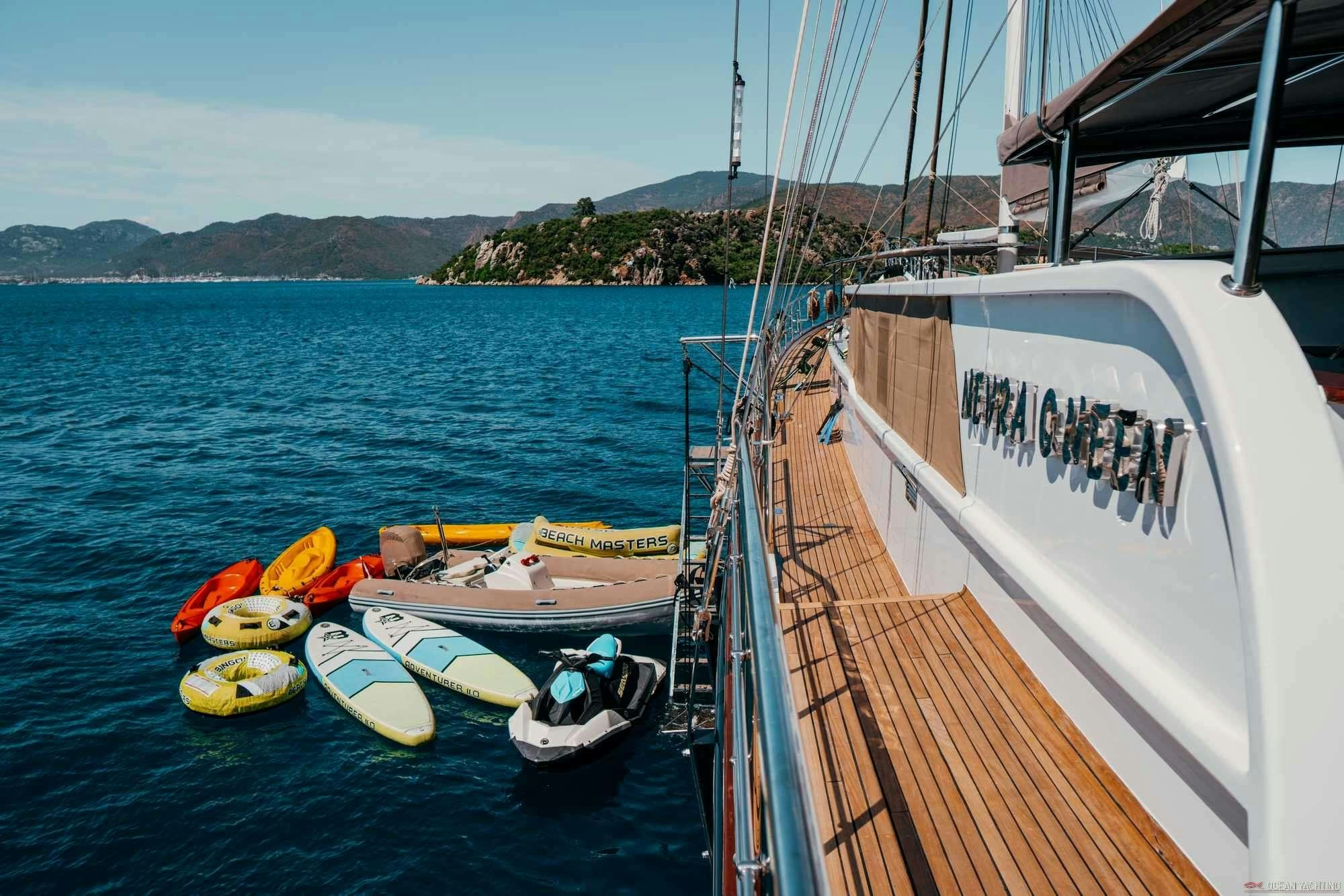 a boat docked at a pier aboard NEVRA QUEEN Yacht for Charter