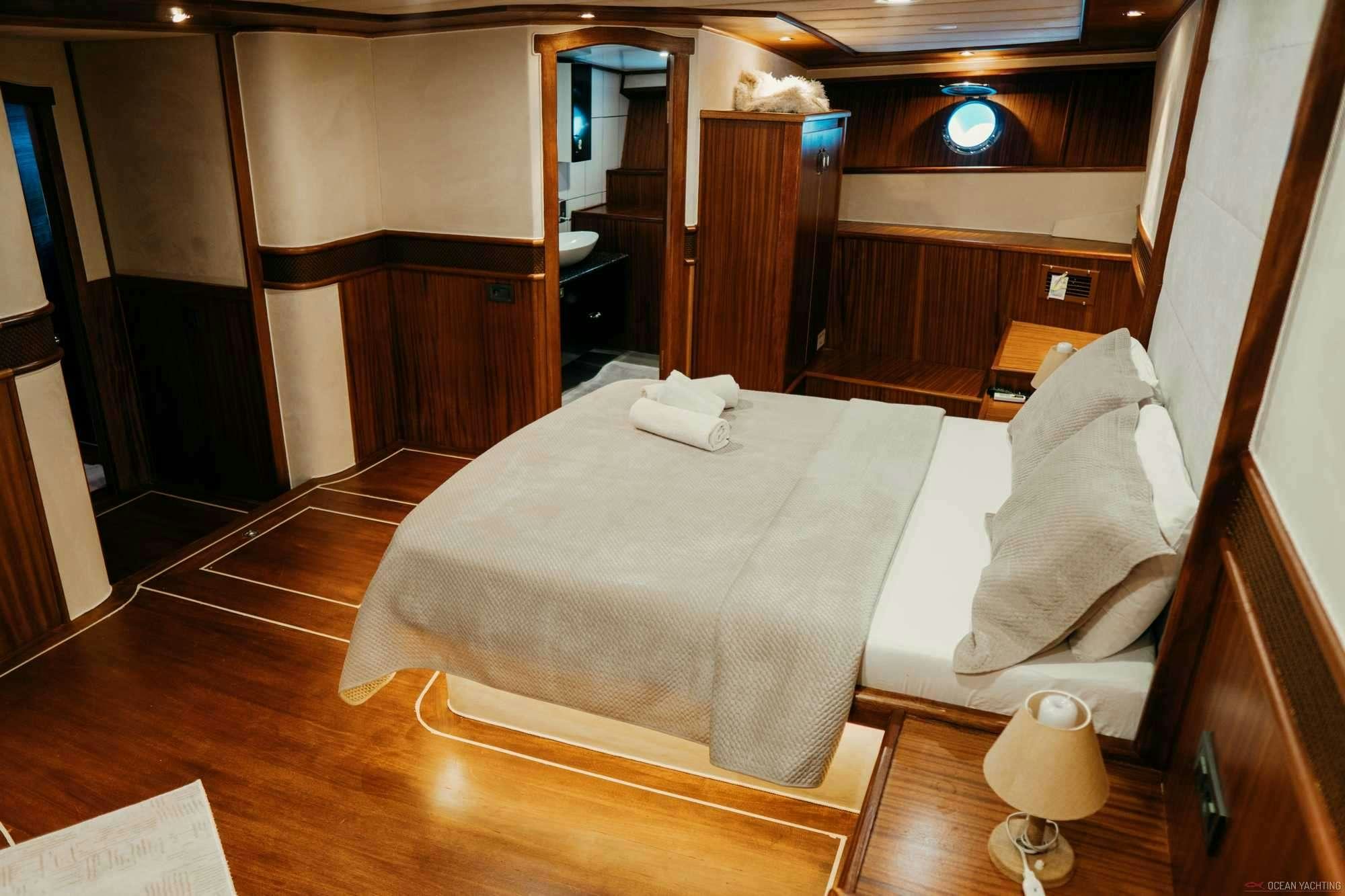 a bed in a room aboard NEVRA QUEEN Yacht for Charter