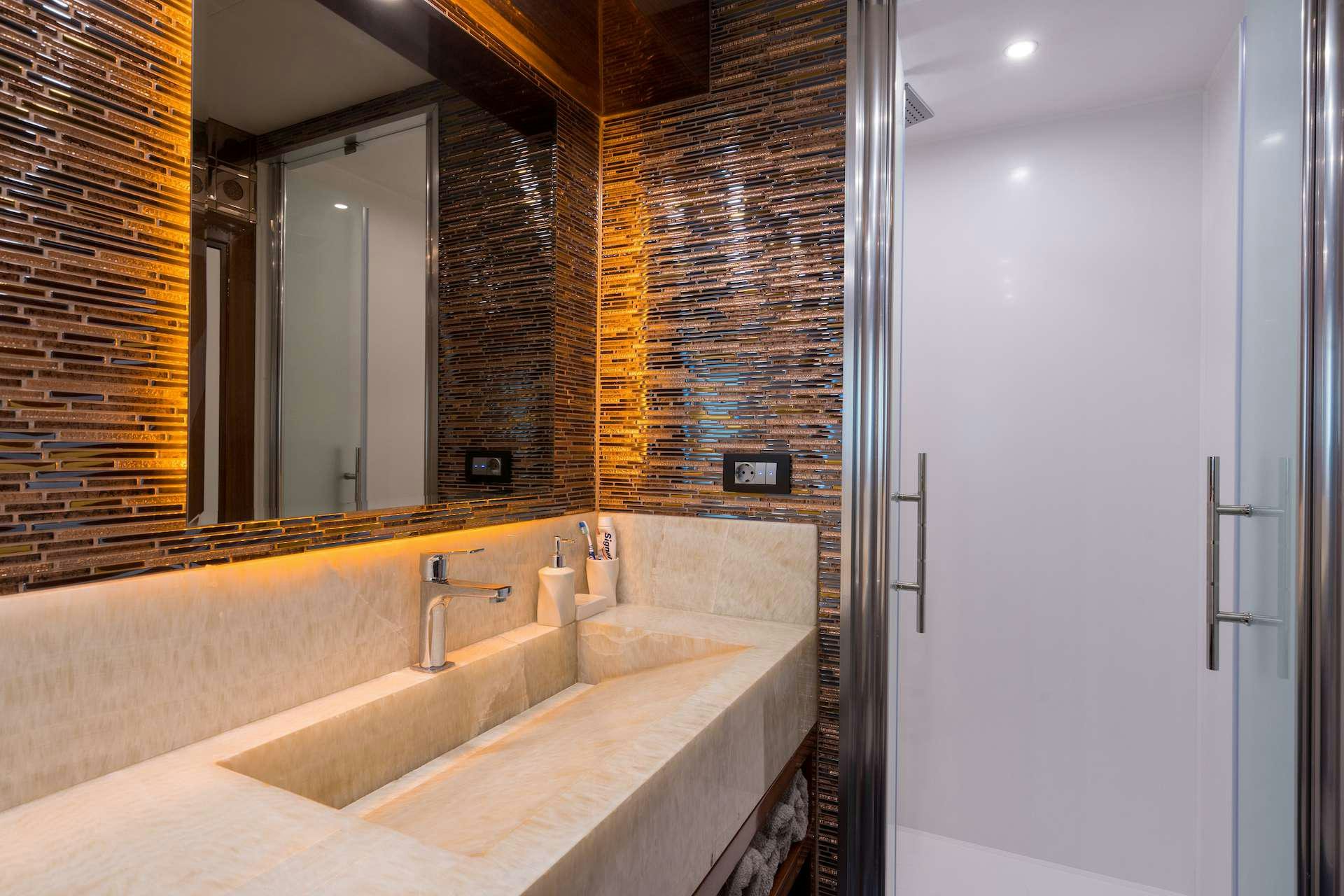 a bathroom with a large mirror aboard LONG ISLAND Yacht for Charter
