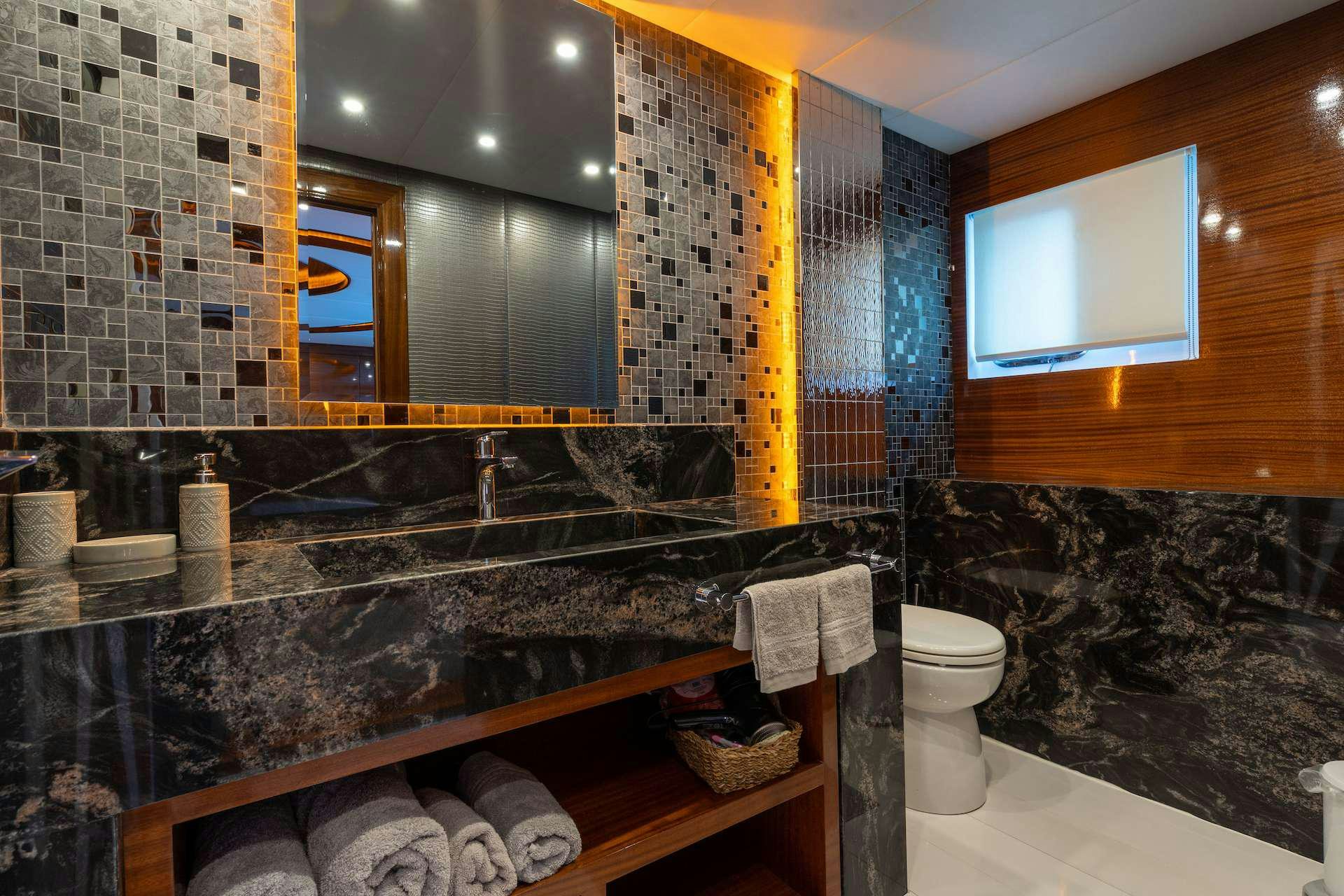 a bathroom with a marble counter aboard LONG ISLAND Yacht for Charter