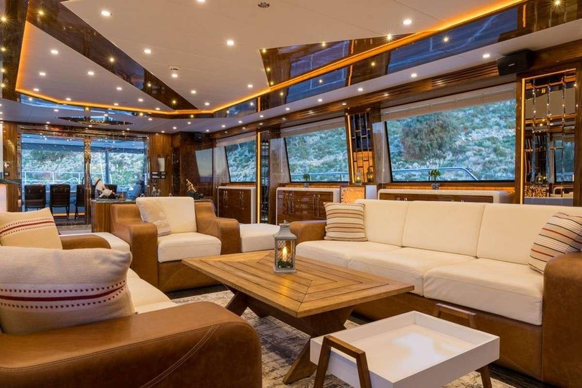 a living room with a large window aboard LONG ISLAND Yacht for Charter