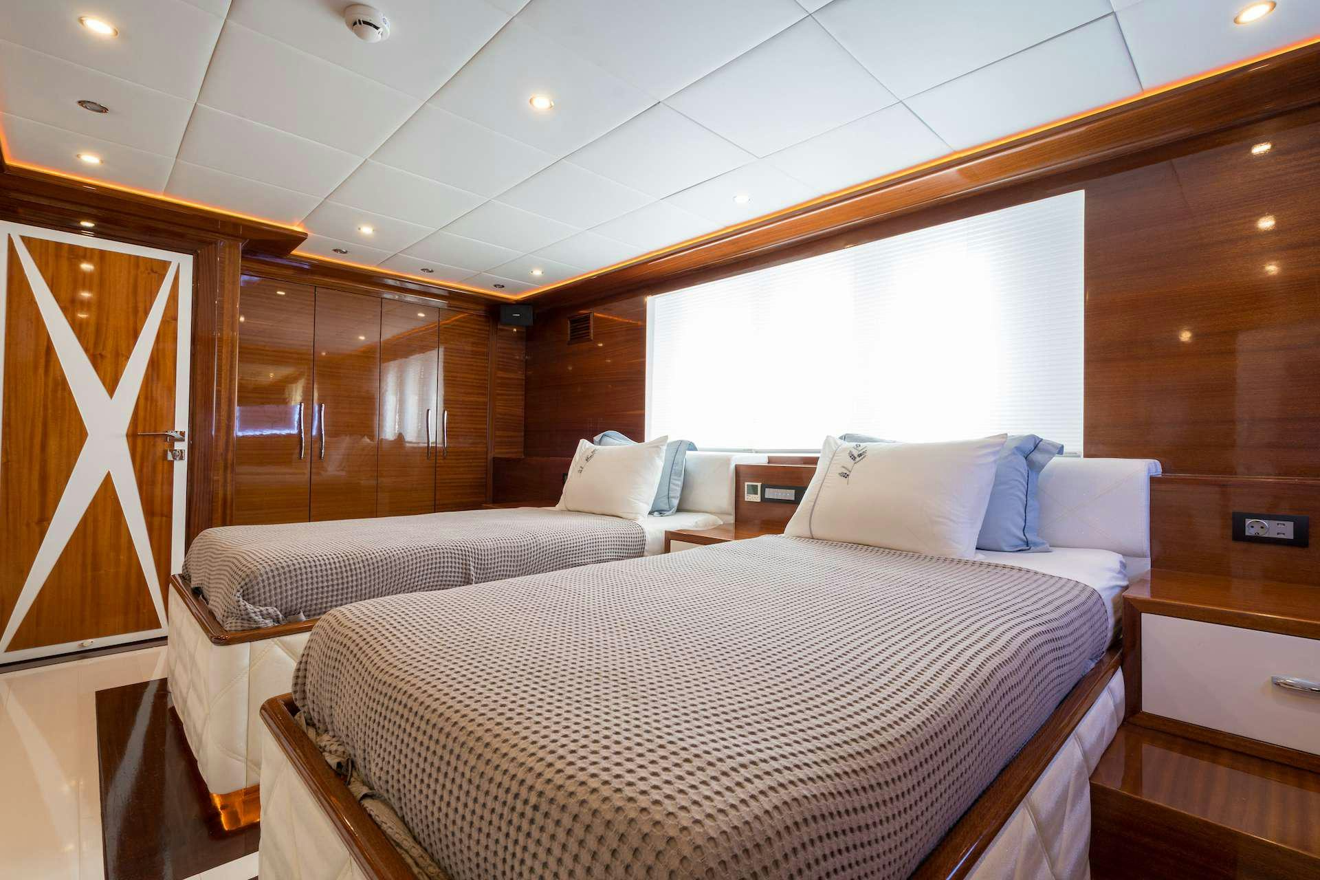 a room with two beds aboard LONG ISLAND Yacht for Charter