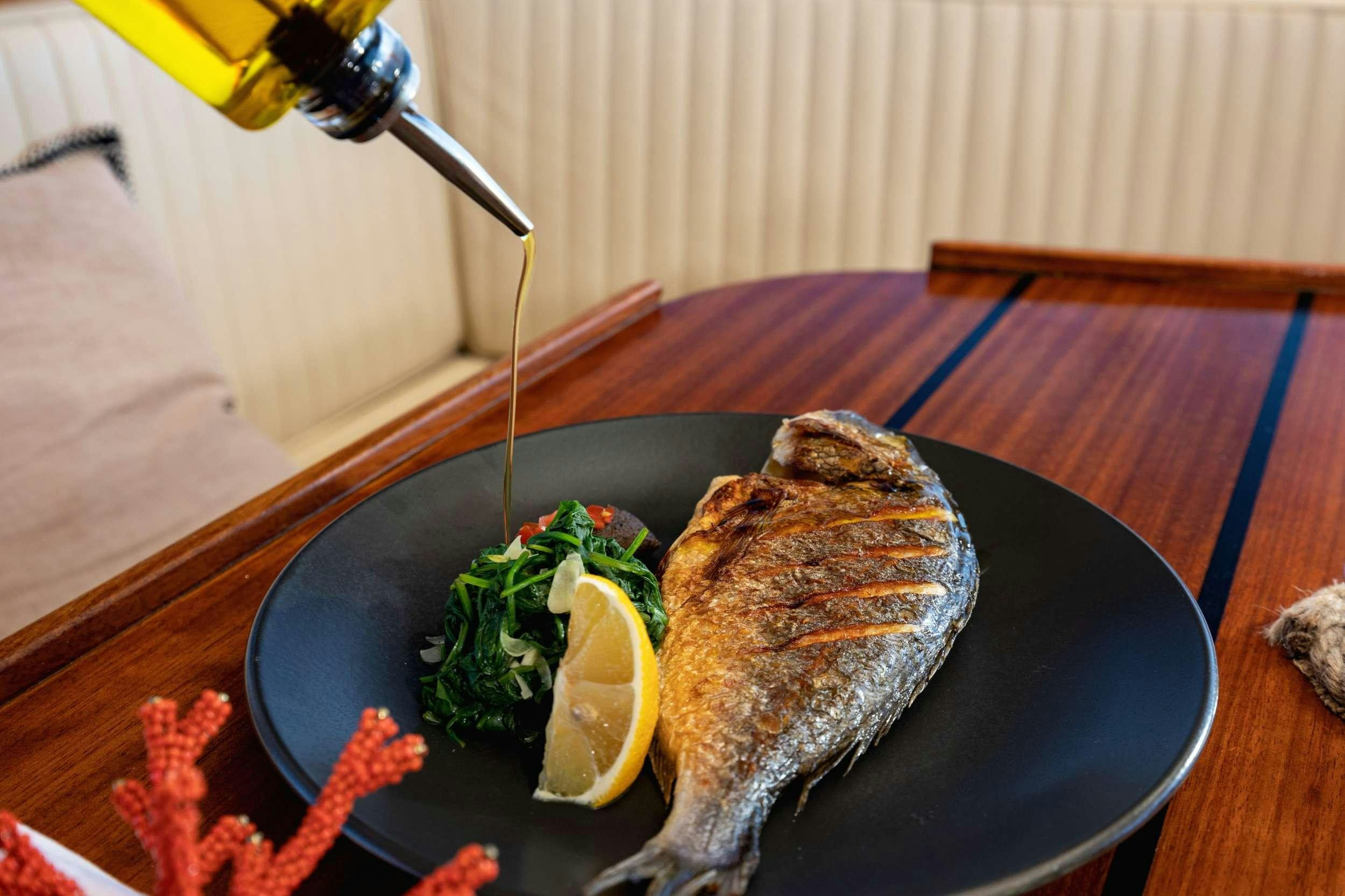 a plate of food aboard ABORDA Yacht for Charter