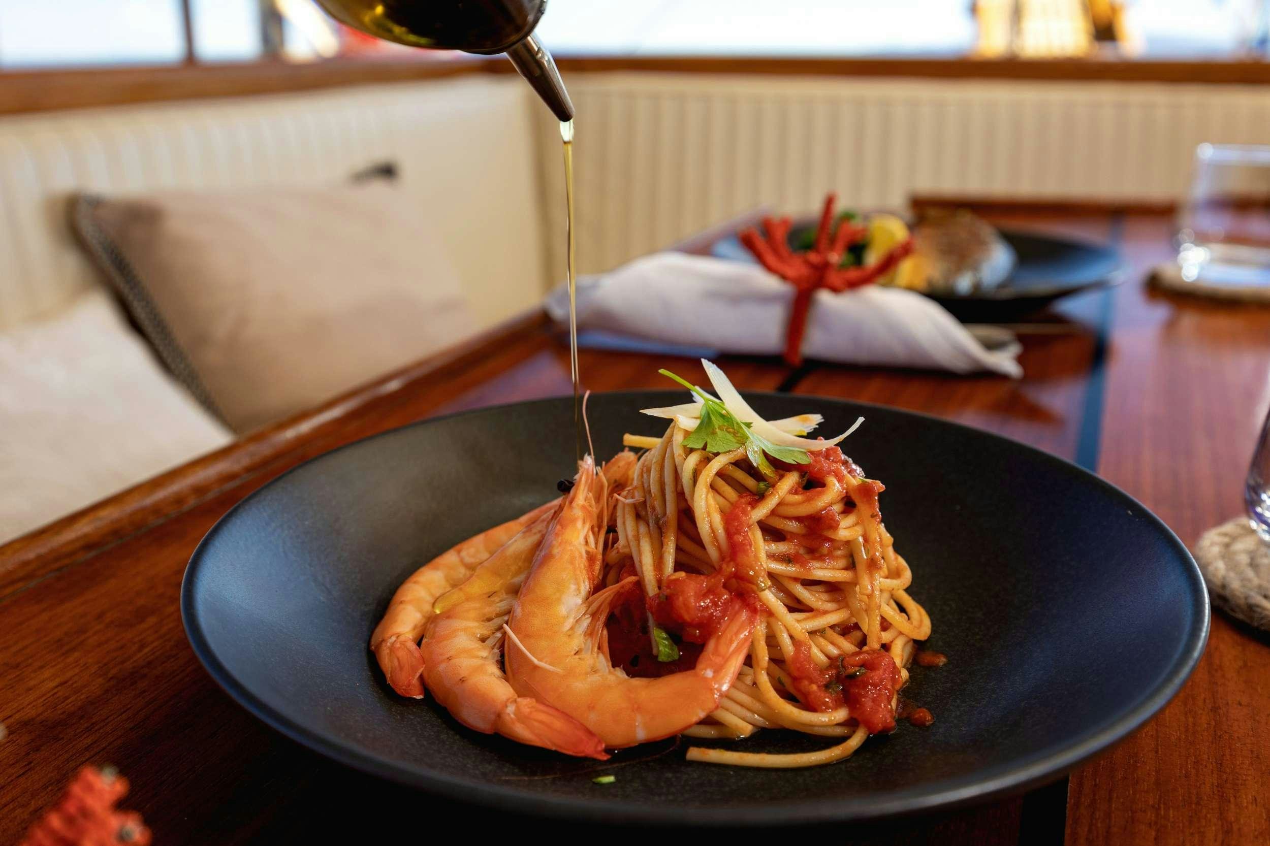 a plate of food aboard ABORDA Yacht for Charter