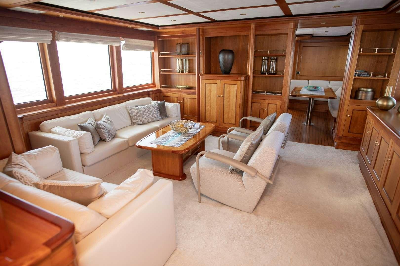 a living room with a couch and a table aboard SEA BREEZE II Yacht for Charter
