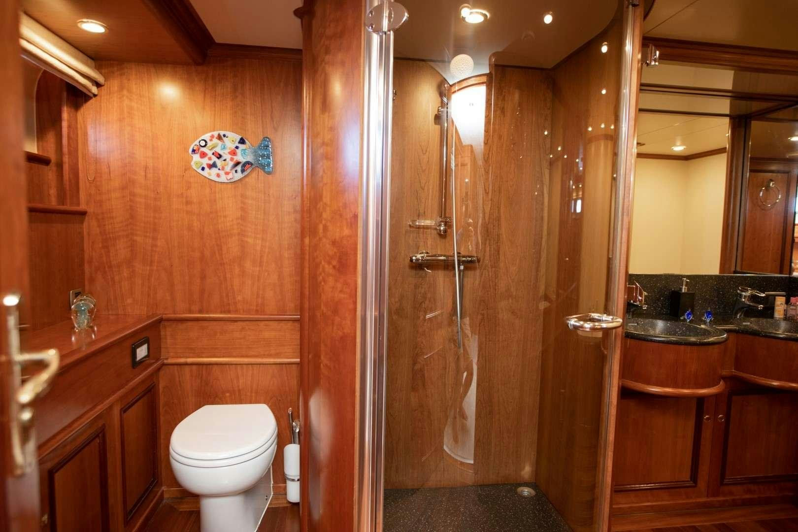 a bathroom with a glass shower aboard SEA BREEZE II Yacht for Charter