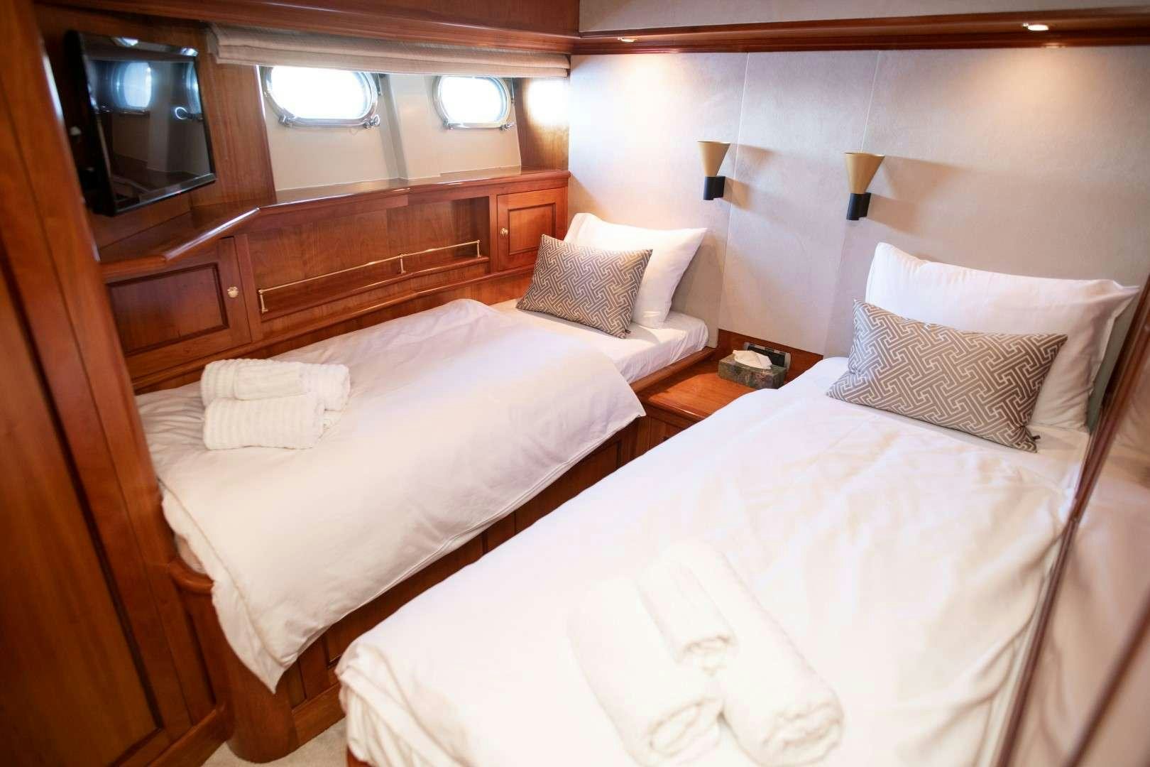 a couple of beds in a room aboard SEA BREEZE II Yacht for Charter