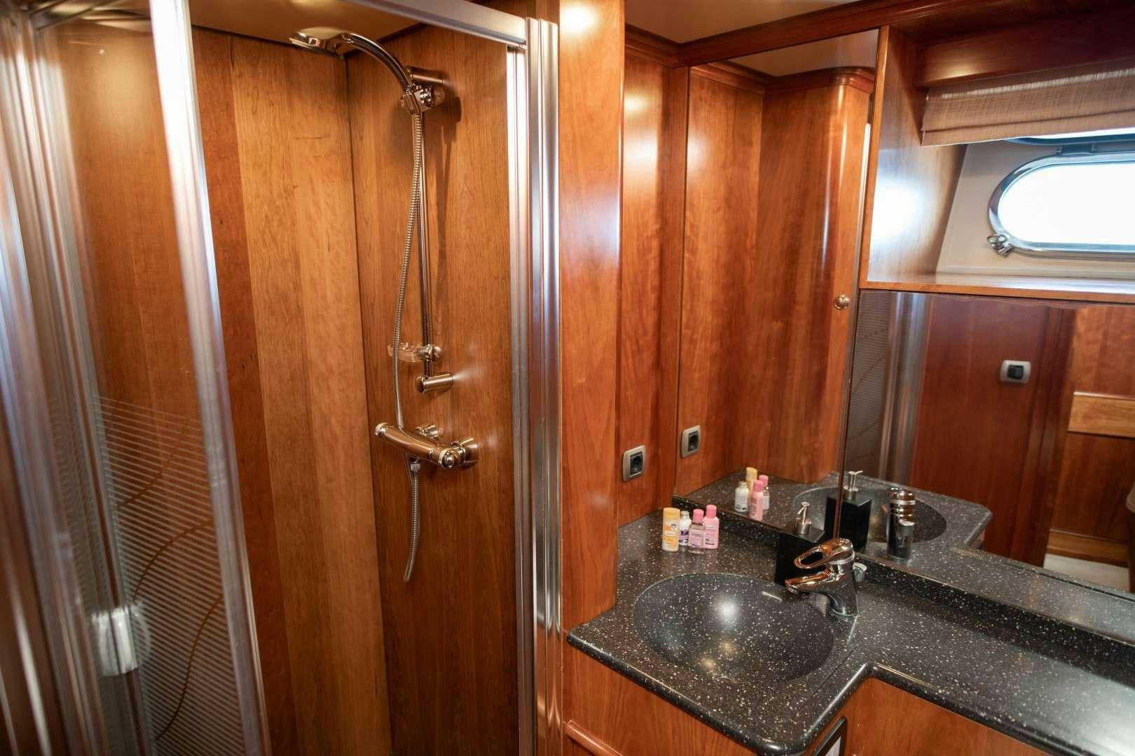 a bathroom with a sink and a shower aboard SEA BREEZE II Yacht for Charter