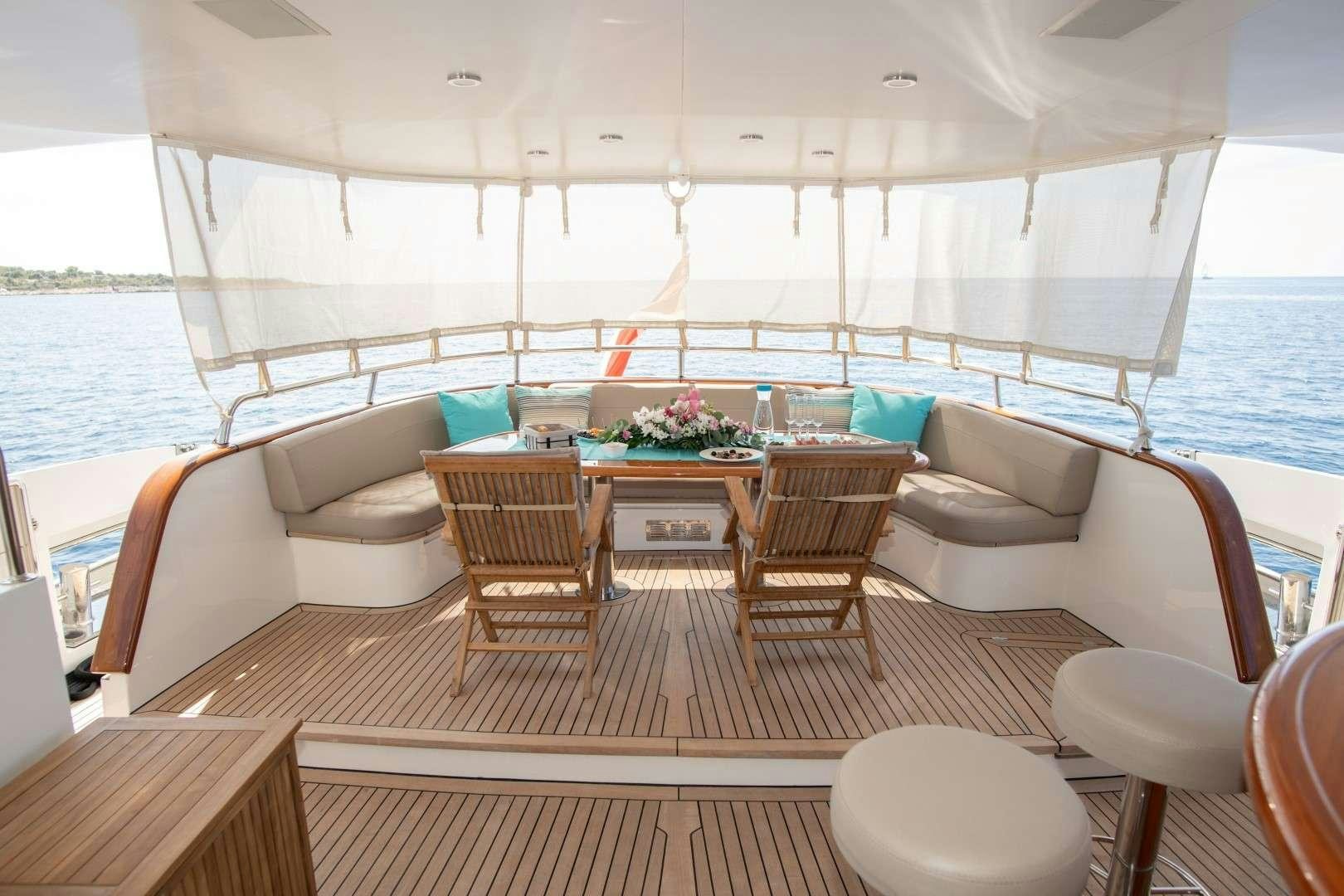 a boat with a table and chairs aboard SEA BREEZE II Yacht for Charter