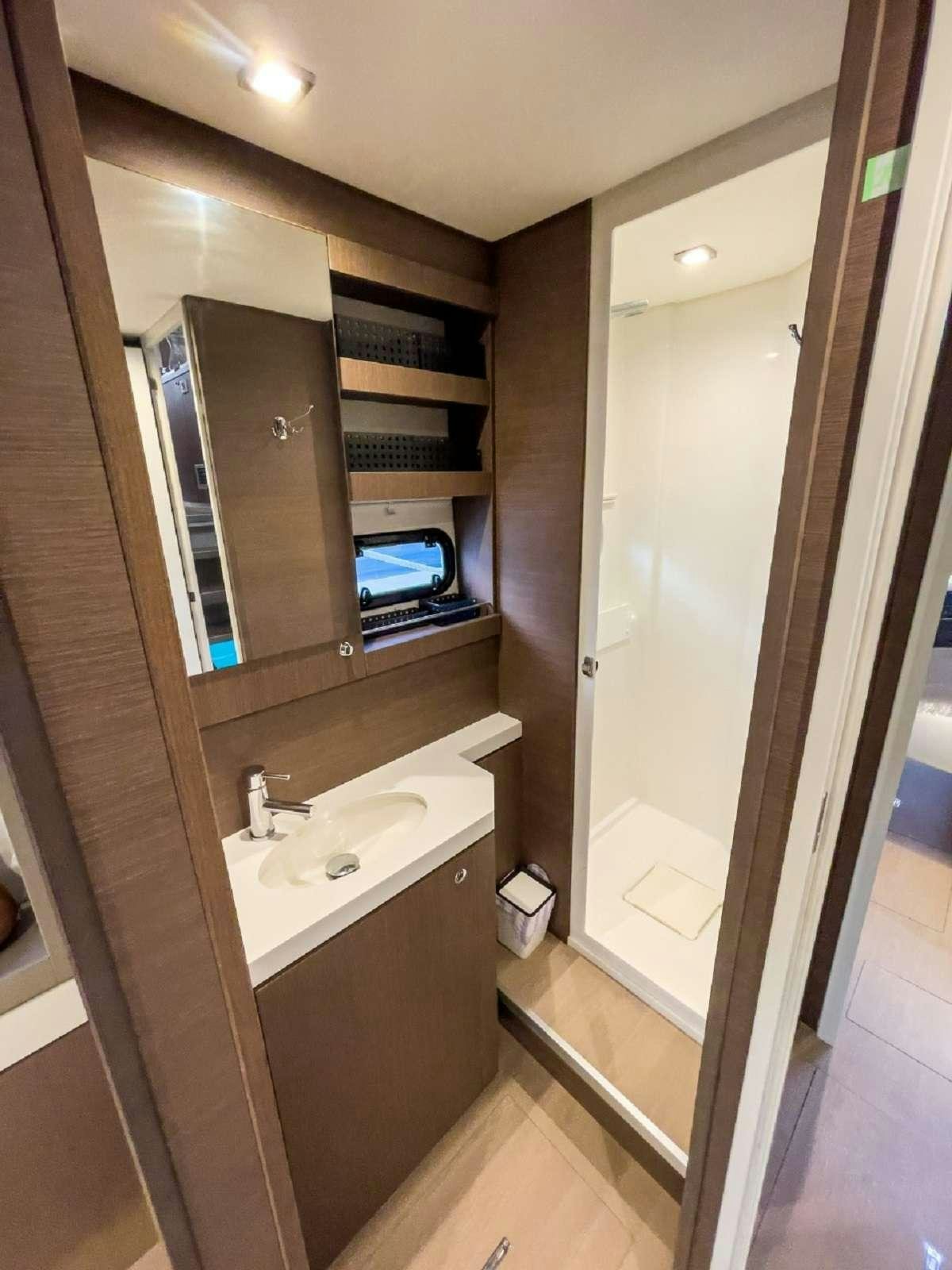 a bathroom with a sink and a mirror aboard ANNA PINK Yacht for Charter