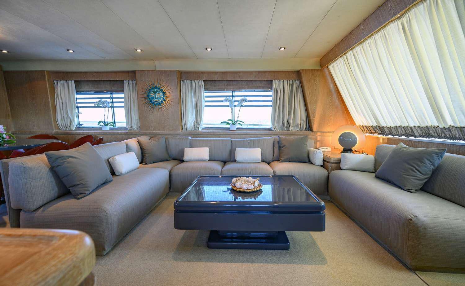 a living room with a couch and a table aboard SANDI IV Yacht for Charter