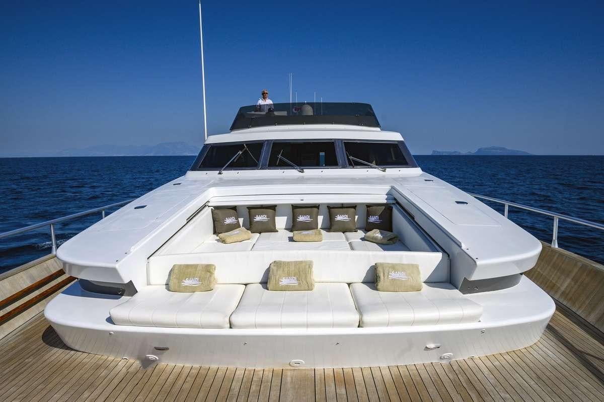 a white yacht on a deck aboard SANDI IV Yacht for Charter