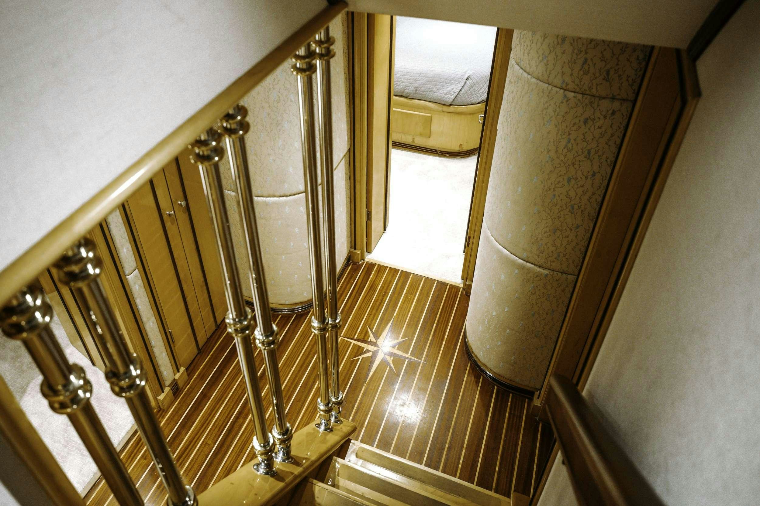 a metal staircase with a metal railing aboard READY II PLAY Yacht for Charter