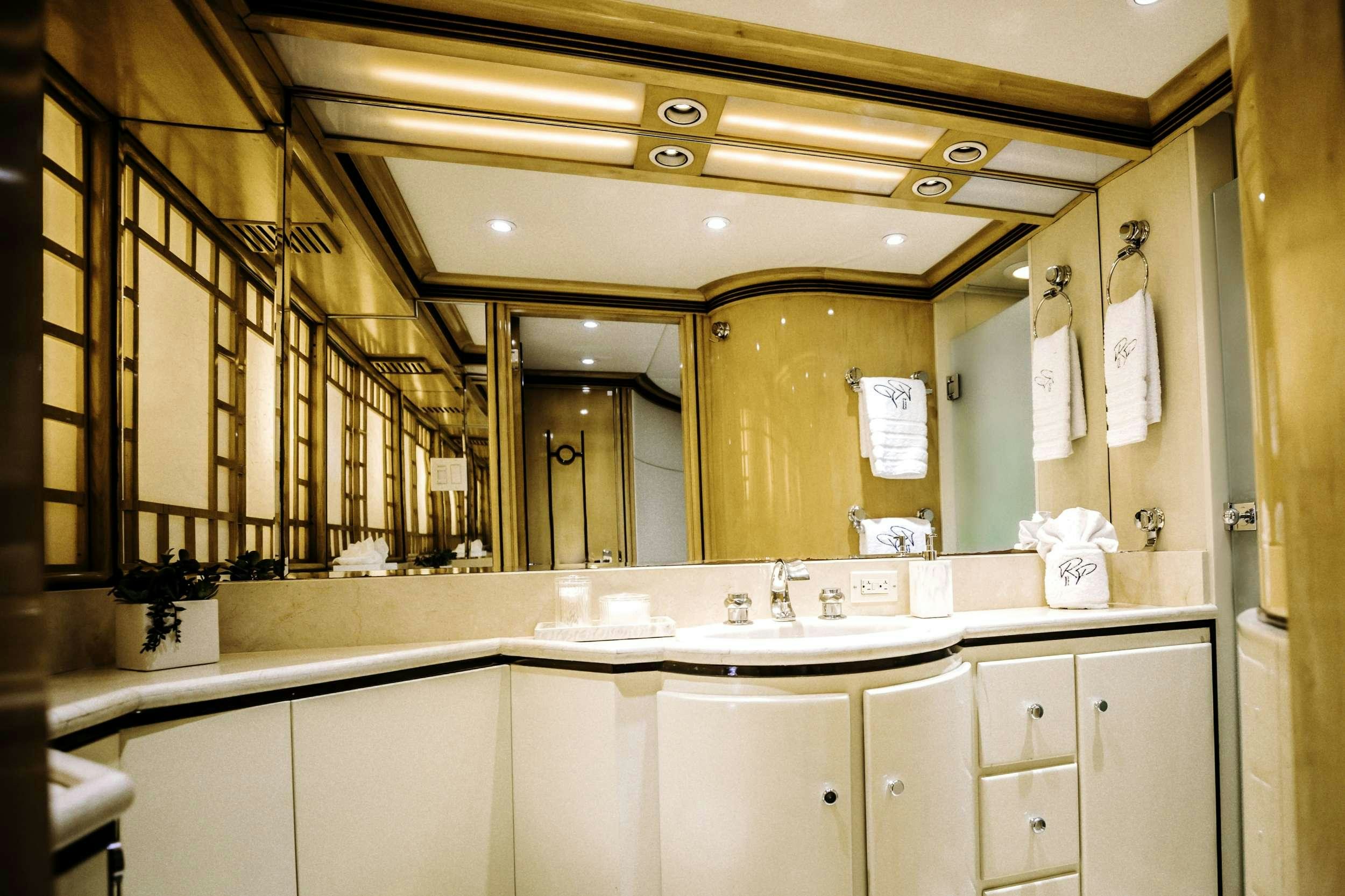 a bathroom with a large mirror aboard READY II PLAY Yacht for Charter