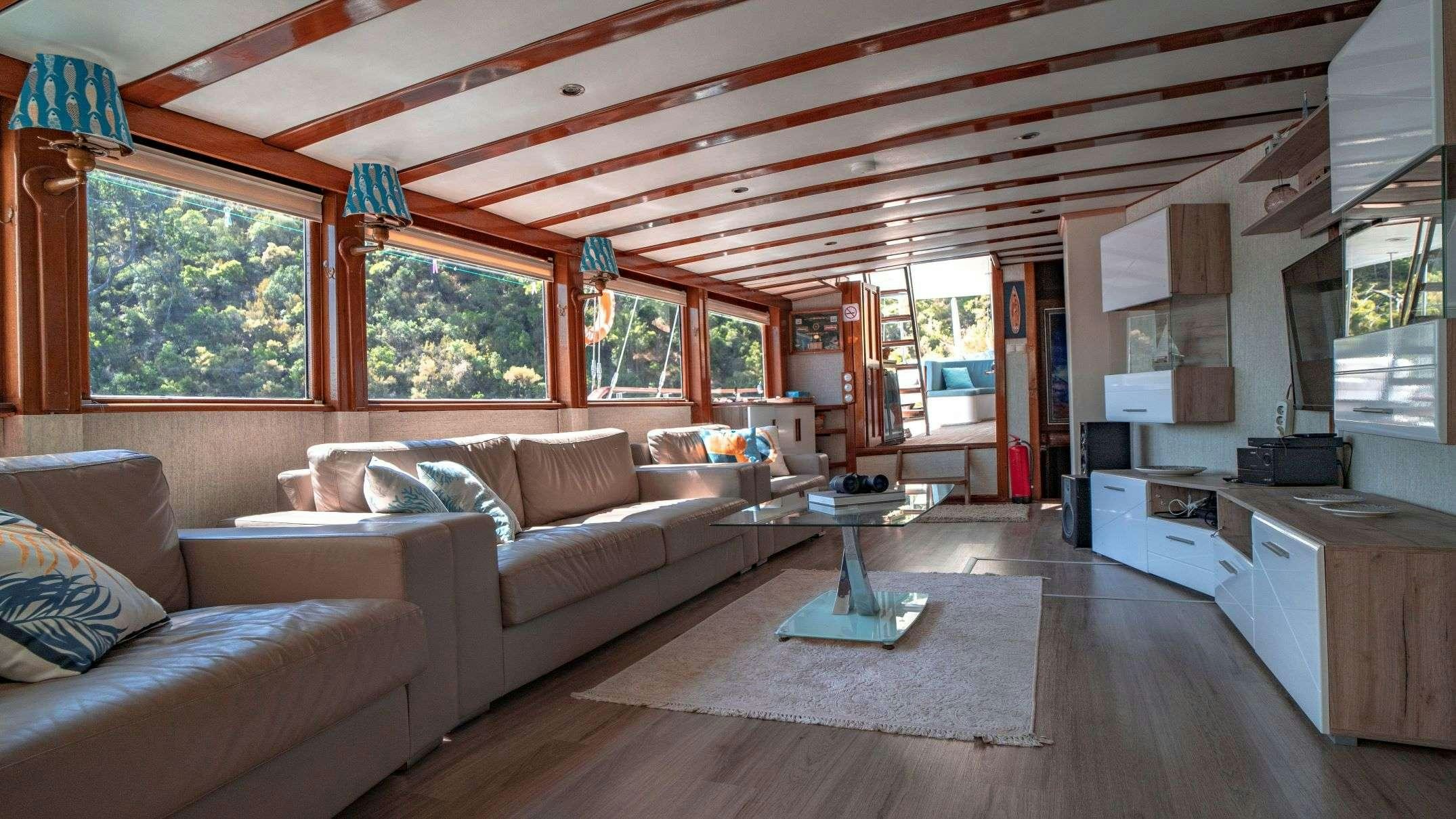 a living room with a large ceiling aboard WHITE SWAN Yacht for Charter