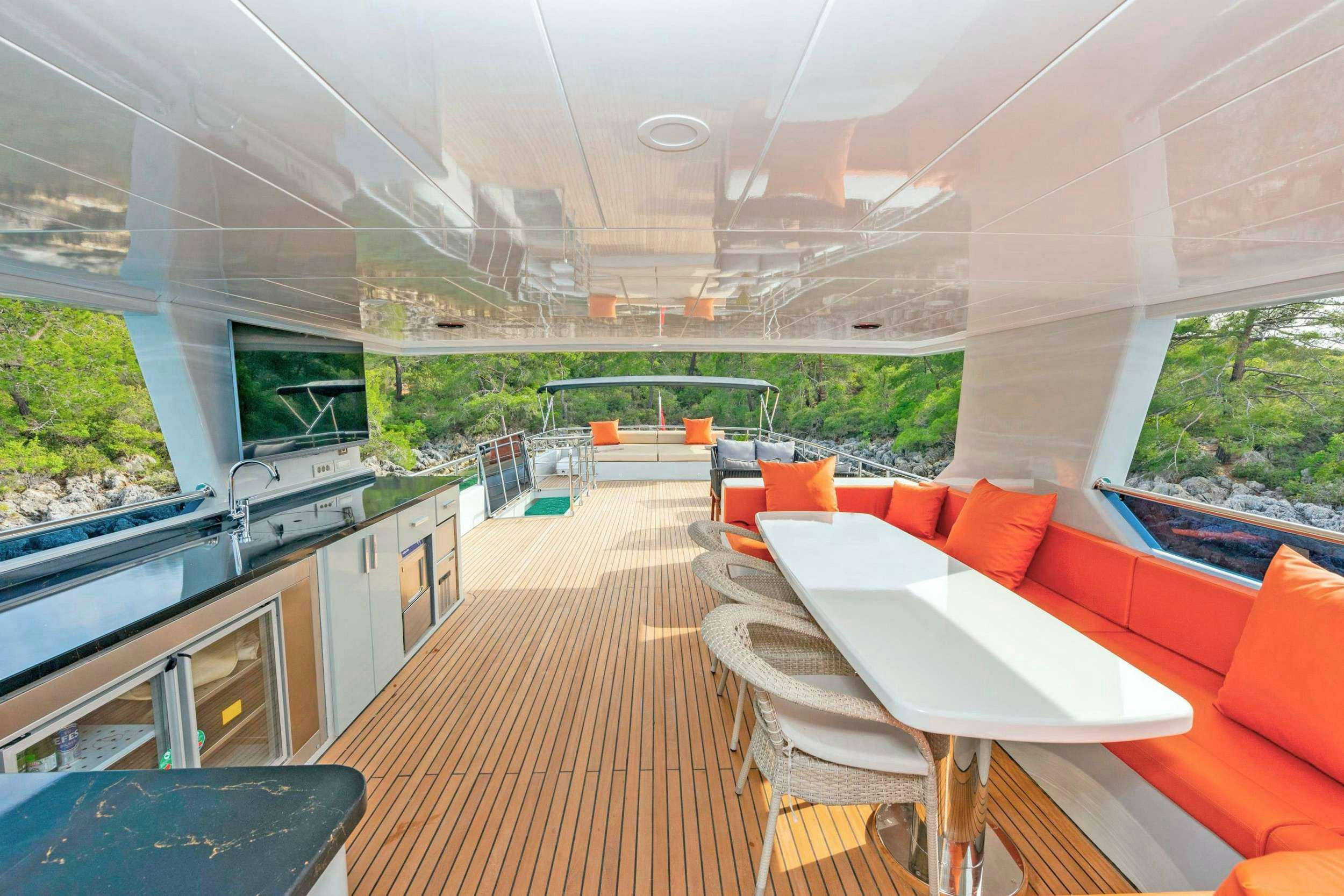 a room with a table and chairs aboard SIMAY M Yacht for Charter