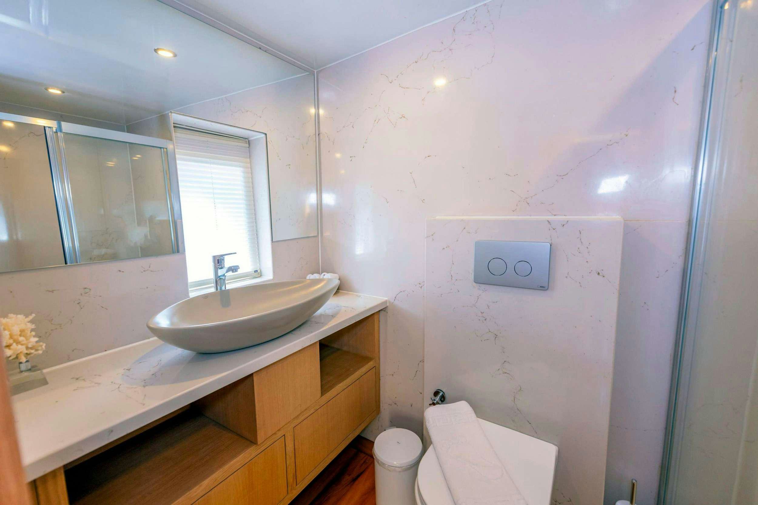 a bathroom with a sink and a toilet aboard SIMAY M Yacht for Charter