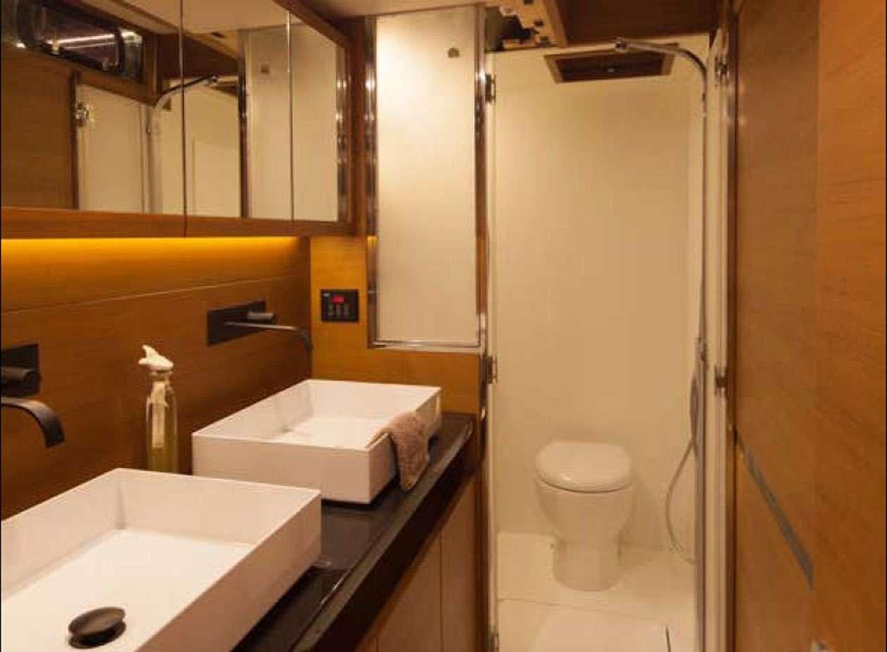 a bathroom with a sink and a toilet aboard SOLARIS 72 Yacht for Charter