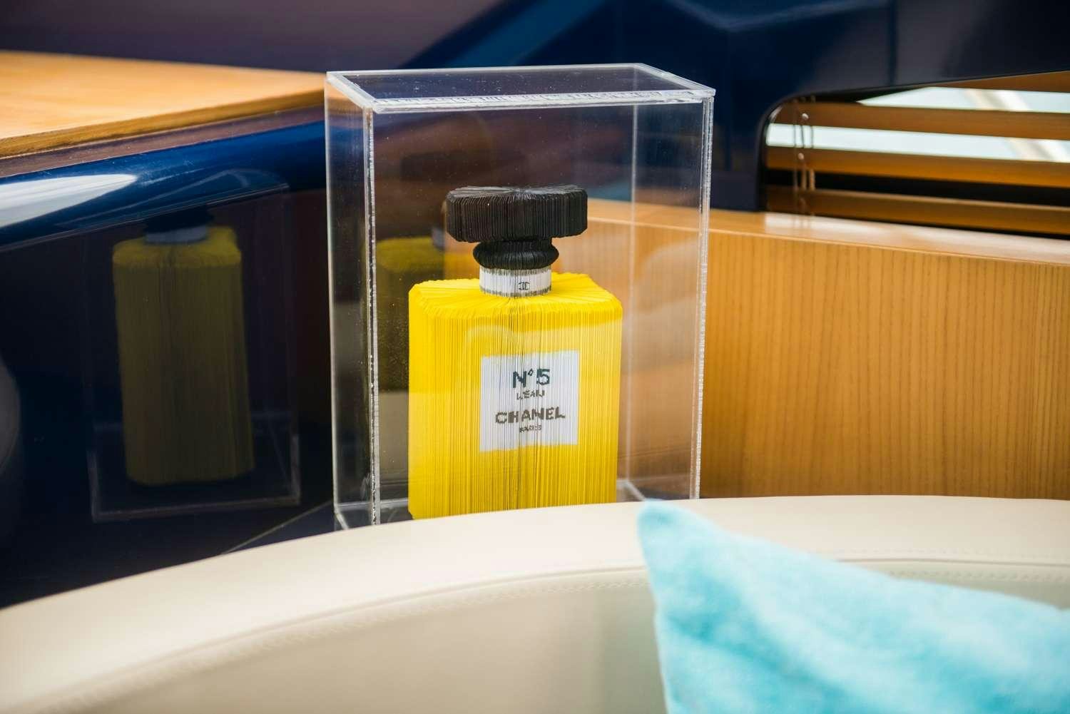 a bottle of perfume aboard ANTAMAR II Yacht for Charter