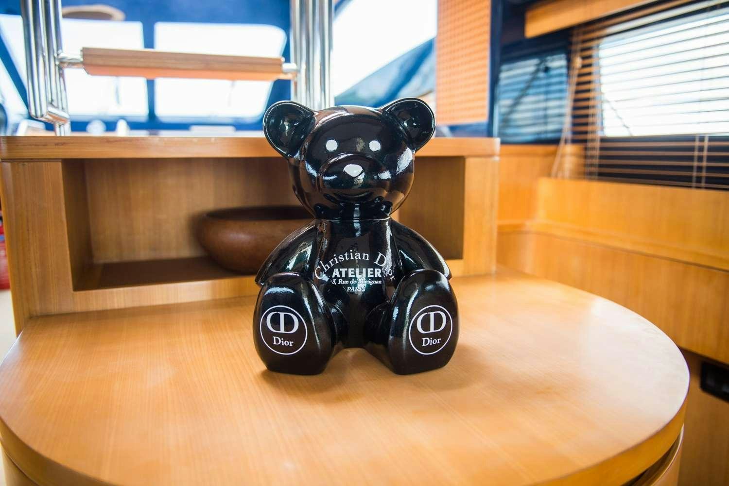 a black toy car on a table aboard ANTAMAR II Yacht for Charter