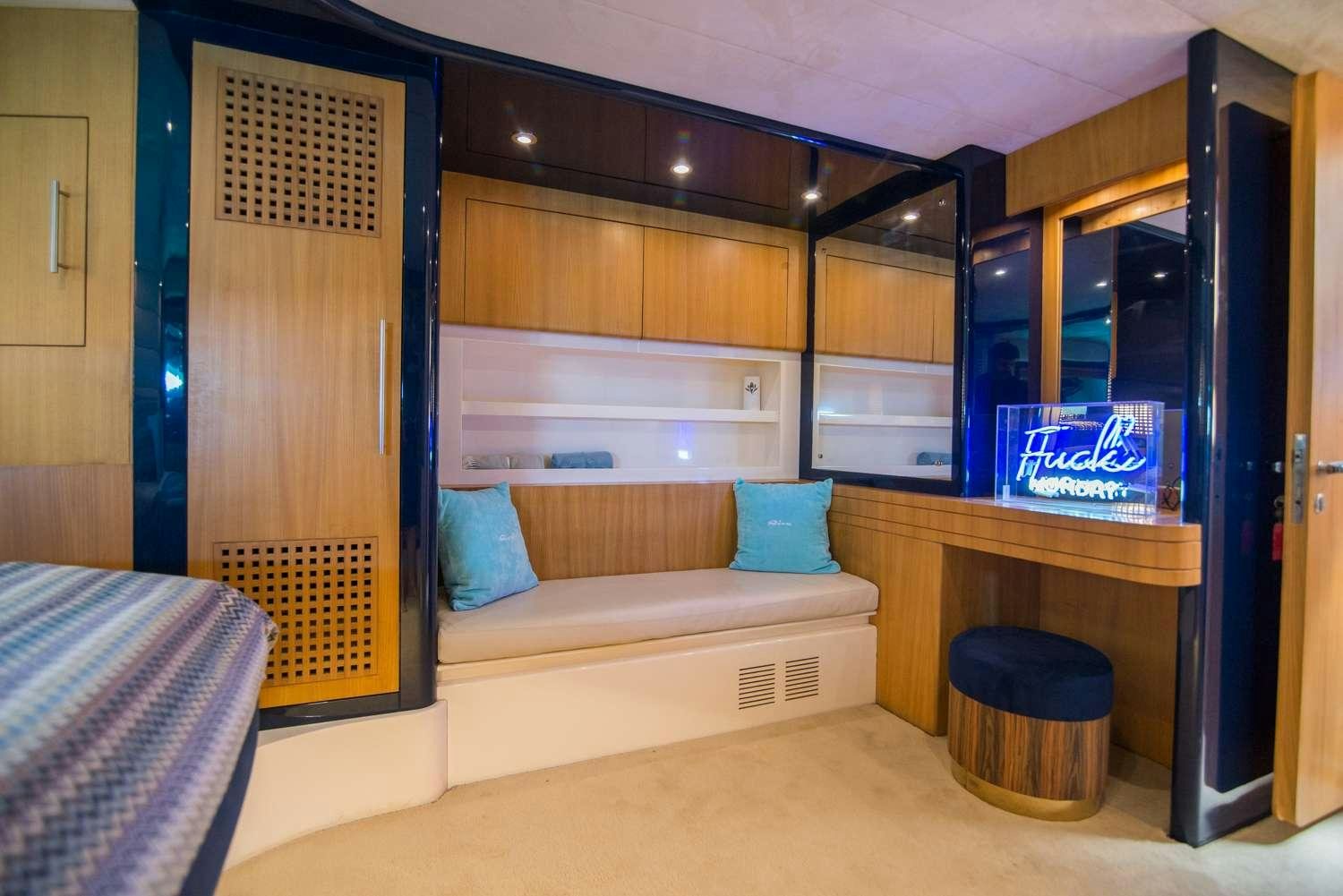 a room with a bed and a desk aboard ANTAMAR II Yacht for Charter