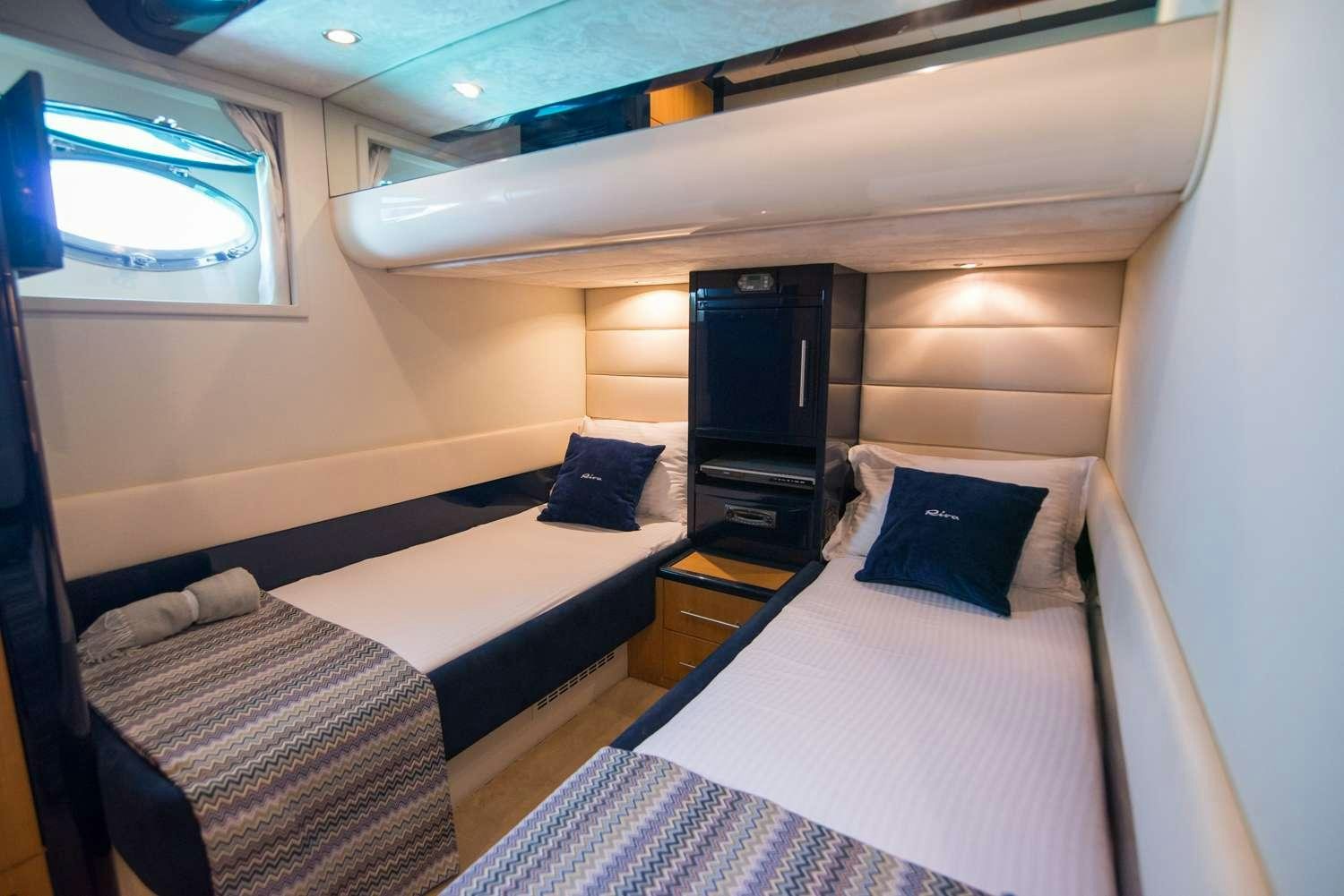 a room with two beds aboard ANTAMAR II Yacht for Charter