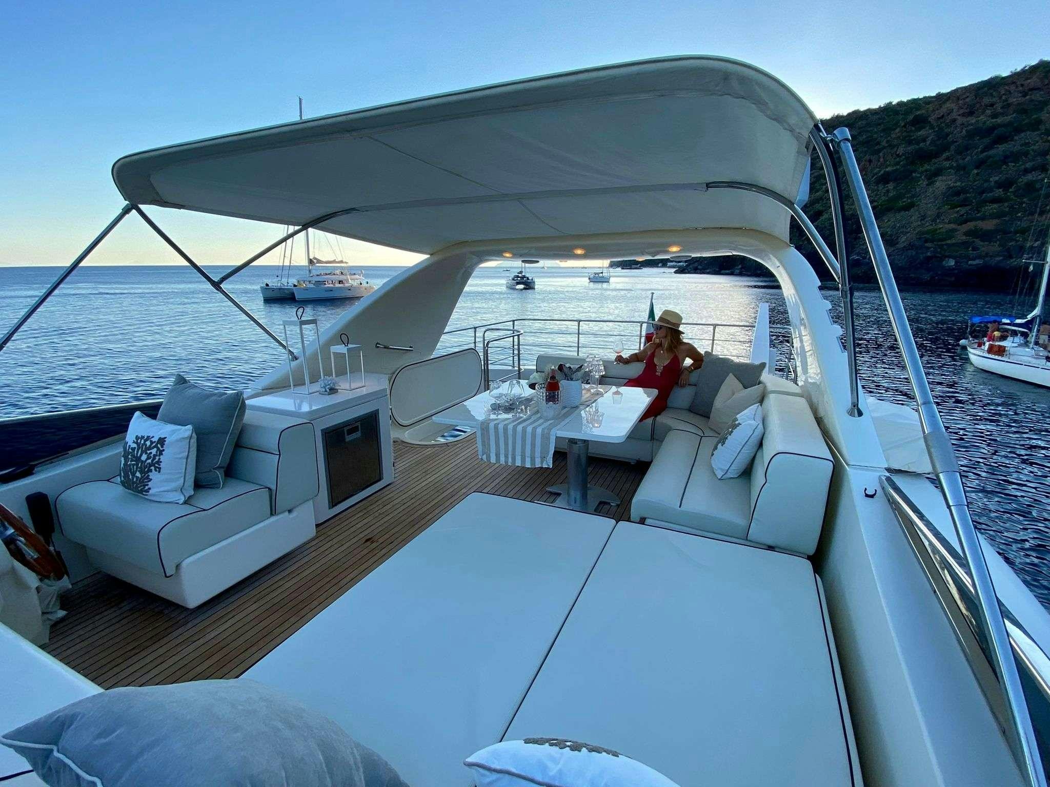 a boat with a person sitting on it aboard BIANCA II Yacht for Charter