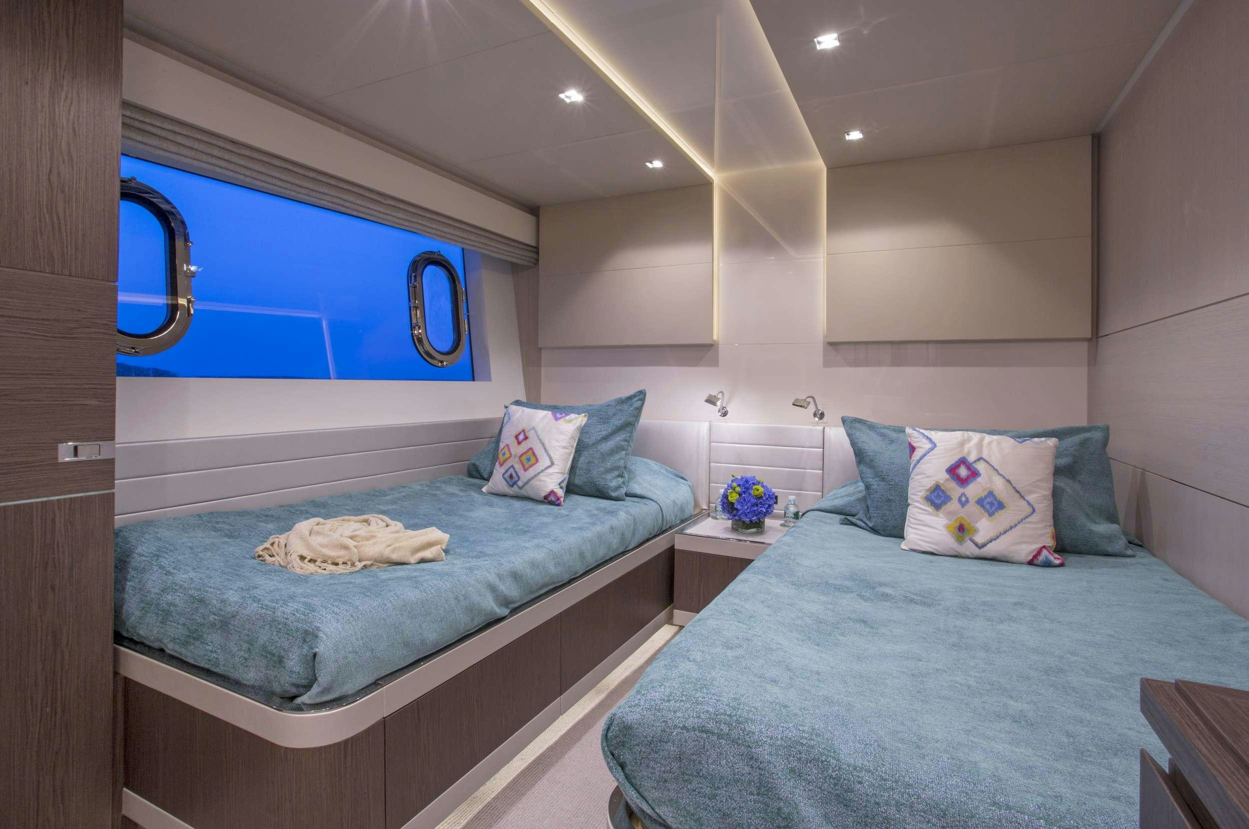 a couple of beds in a room aboard ALANDREA Yacht for Charter
