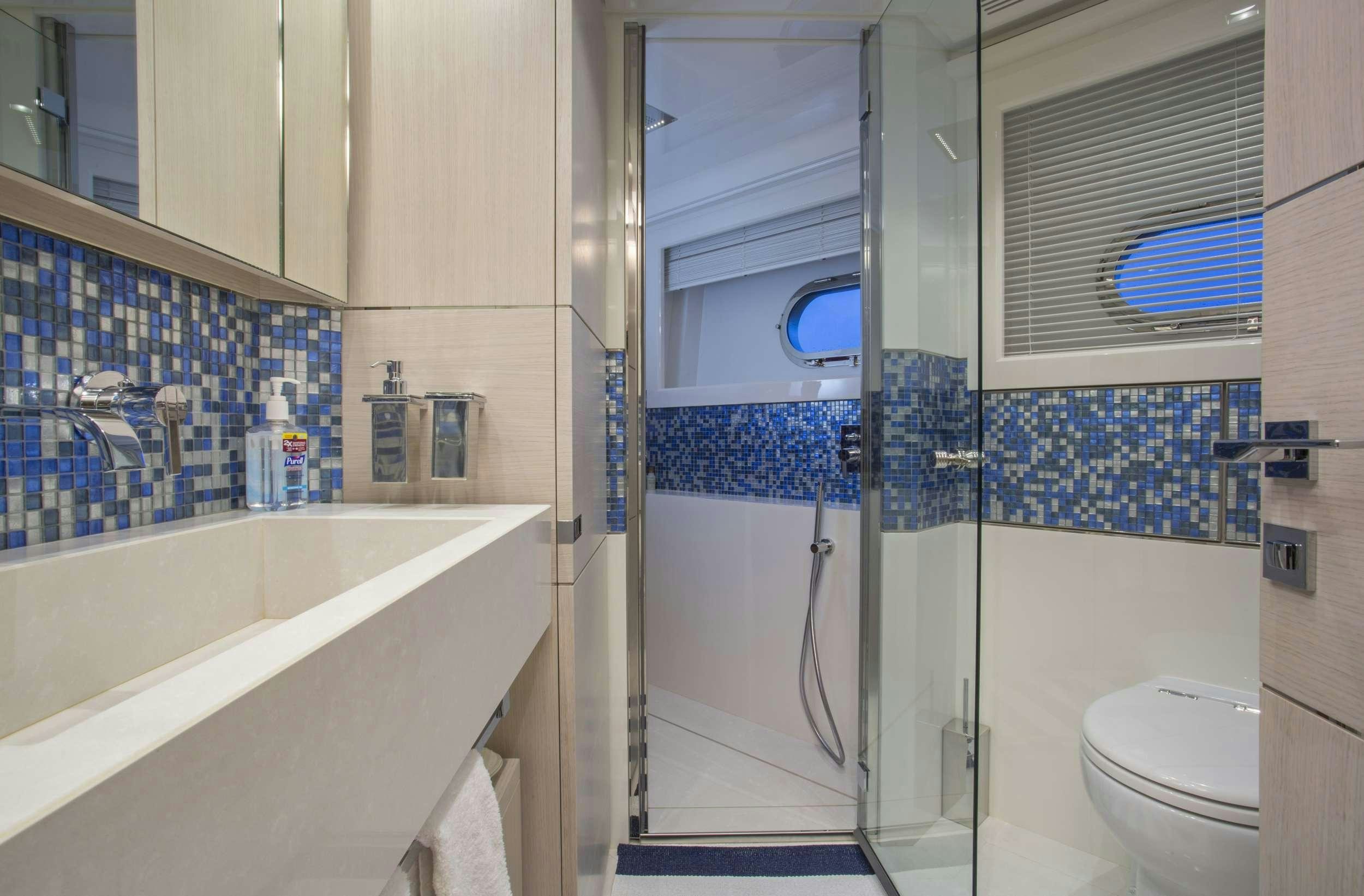 a bathroom with a shower and a sink aboard ALANDREA Yacht for Charter