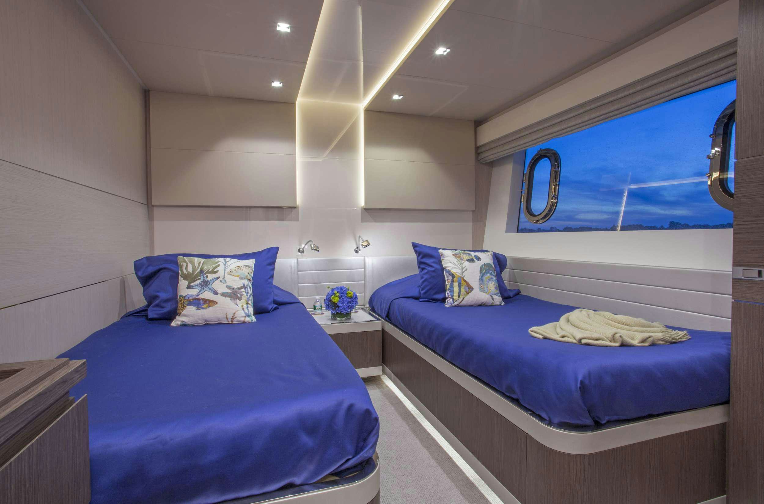 a couple of beds in a room aboard ALANDREA Yacht for Charter